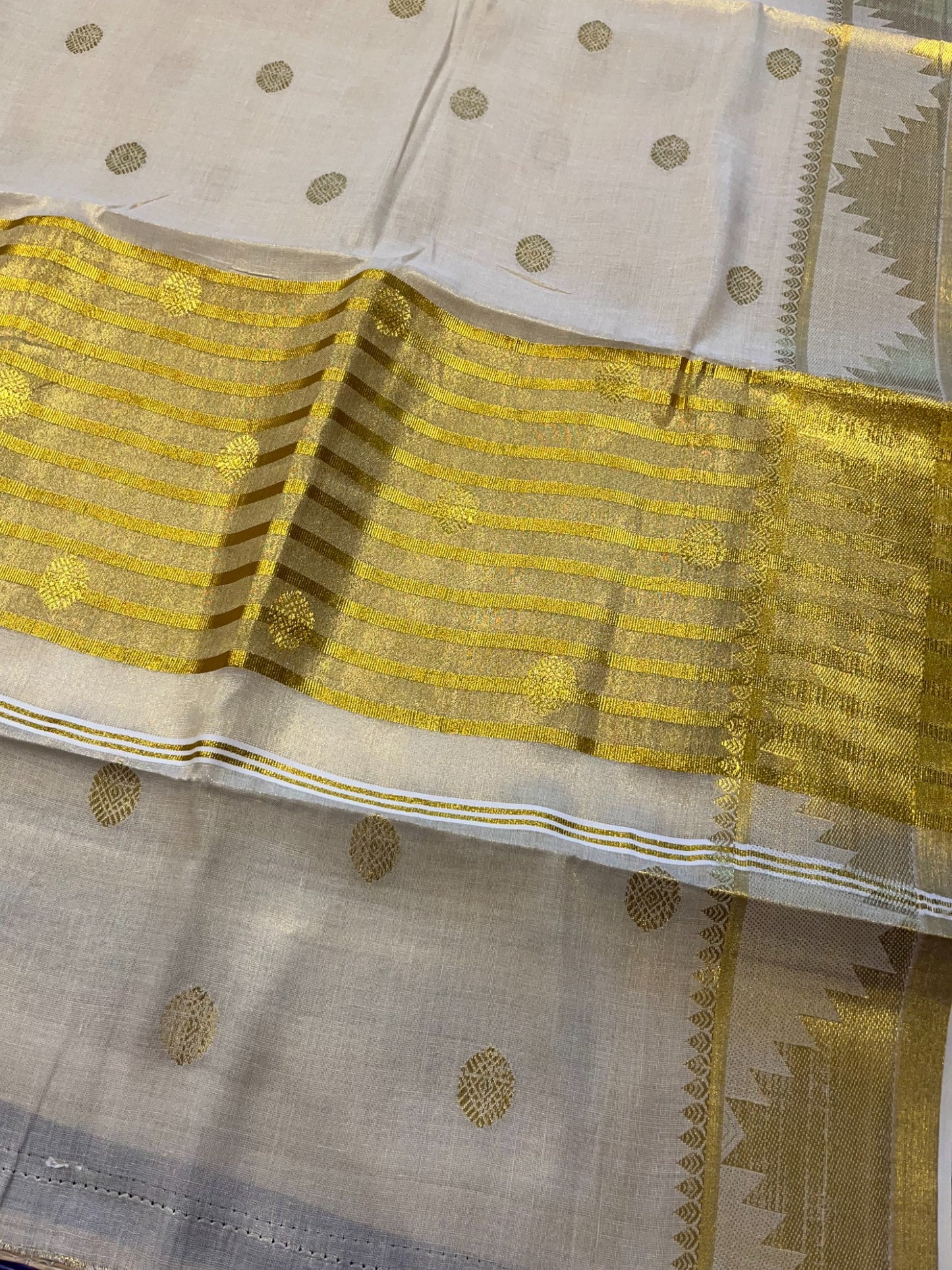Southloom Tissue Kasavu Saree with Woven Butta Works Across Body and Temple Border