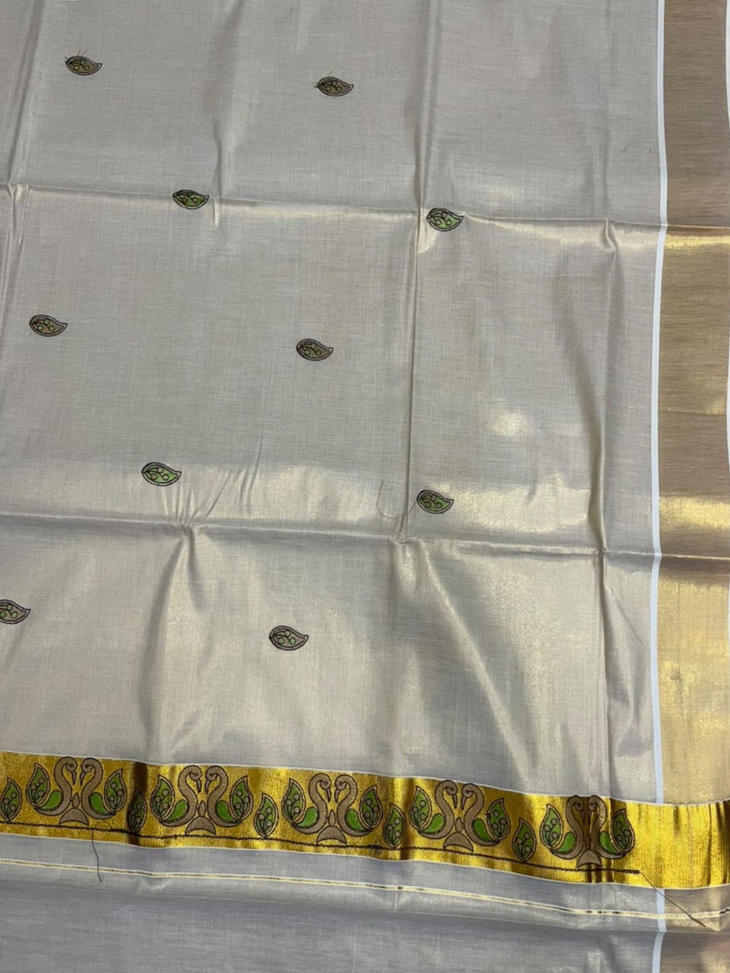 Southloom Tissue Kerala Kasavu Saree with Peacock Embroidery Design On Border