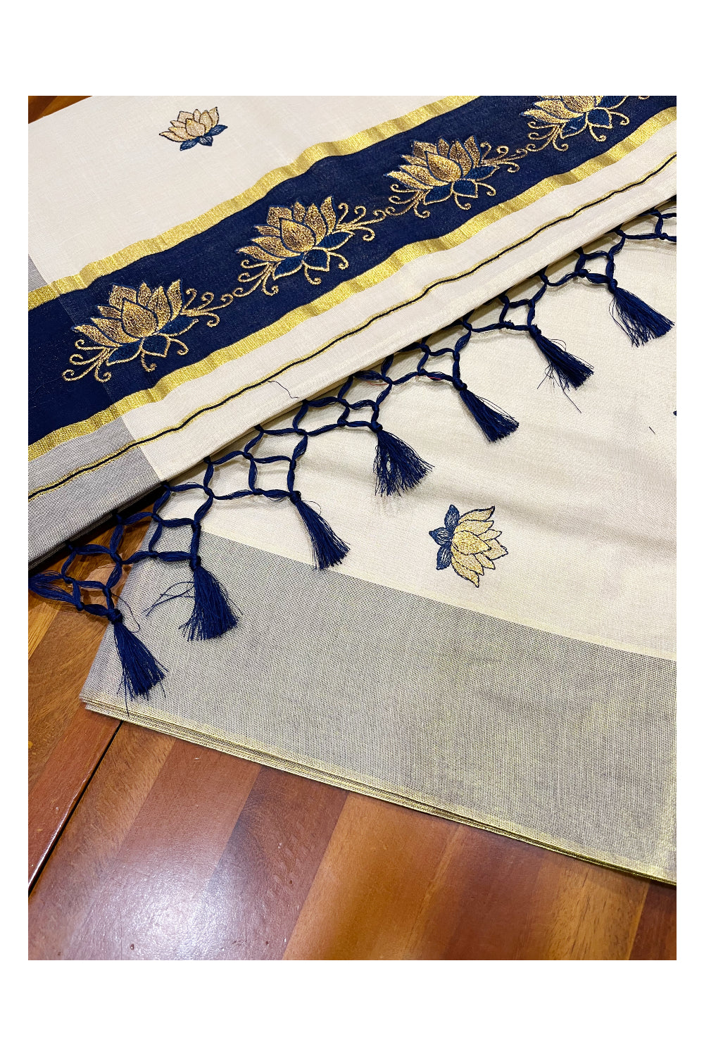 Southloom Kerala Tissue Kasavu Saree with Blue And Golden Lotus Embroidary Designs on Body