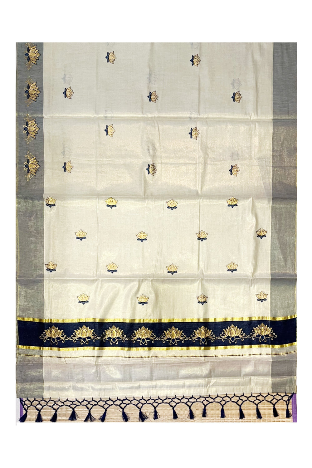 Southloom Kerala Tissue Kasavu Saree with Blue And Golden Lotus Embroidary Designs on Body