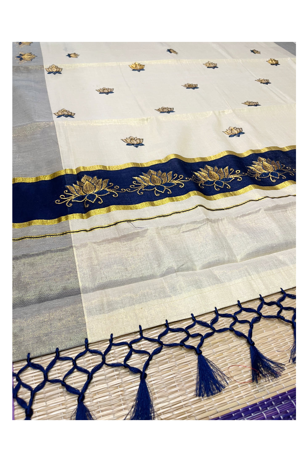 Southloom Kerala Tissue Kasavu Saree with Blue And Golden Lotus Embroidary Designs on Body