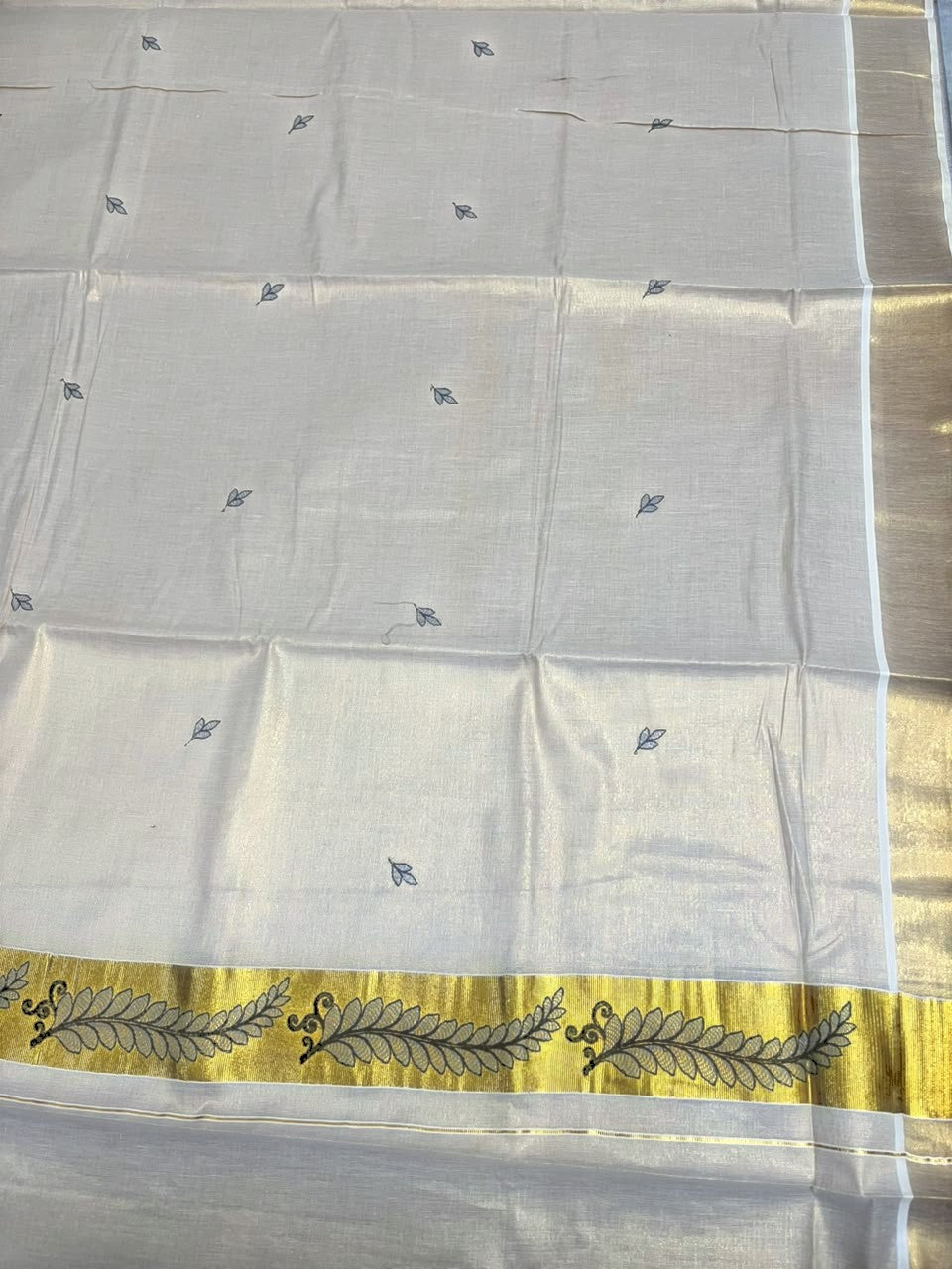 Southloom Tissue Kerala Kasavu Saree with Floral Embroidery Design On Border