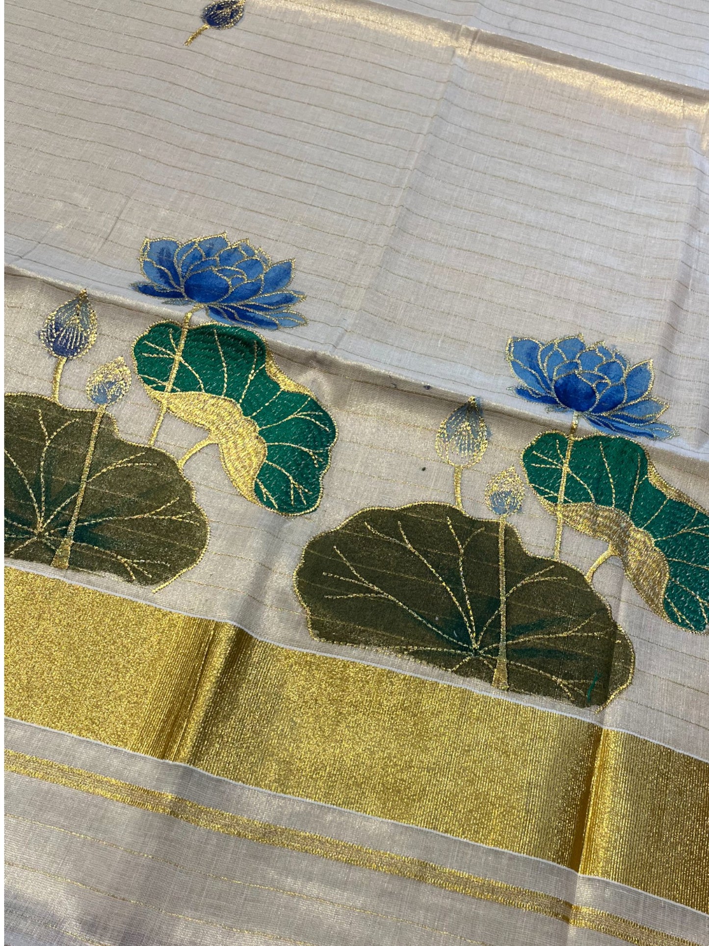 Southloom Tissue Kerala Kasavu Saree with Hand Painted Embroidery Blue Lotus Design