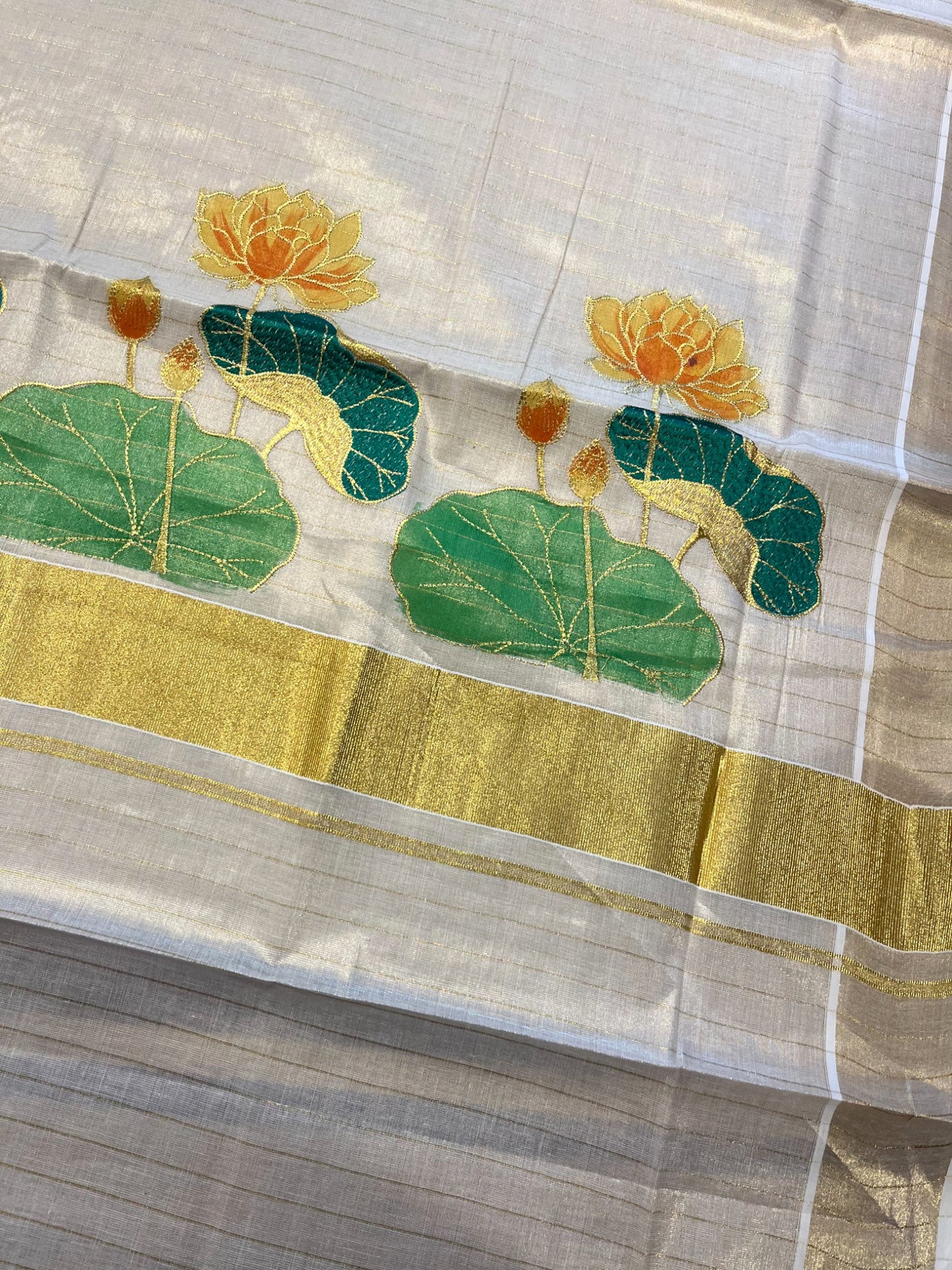 Southloom Tissue Kerala Kasavu Saree with Hand Painted Embroidery Lotus Design