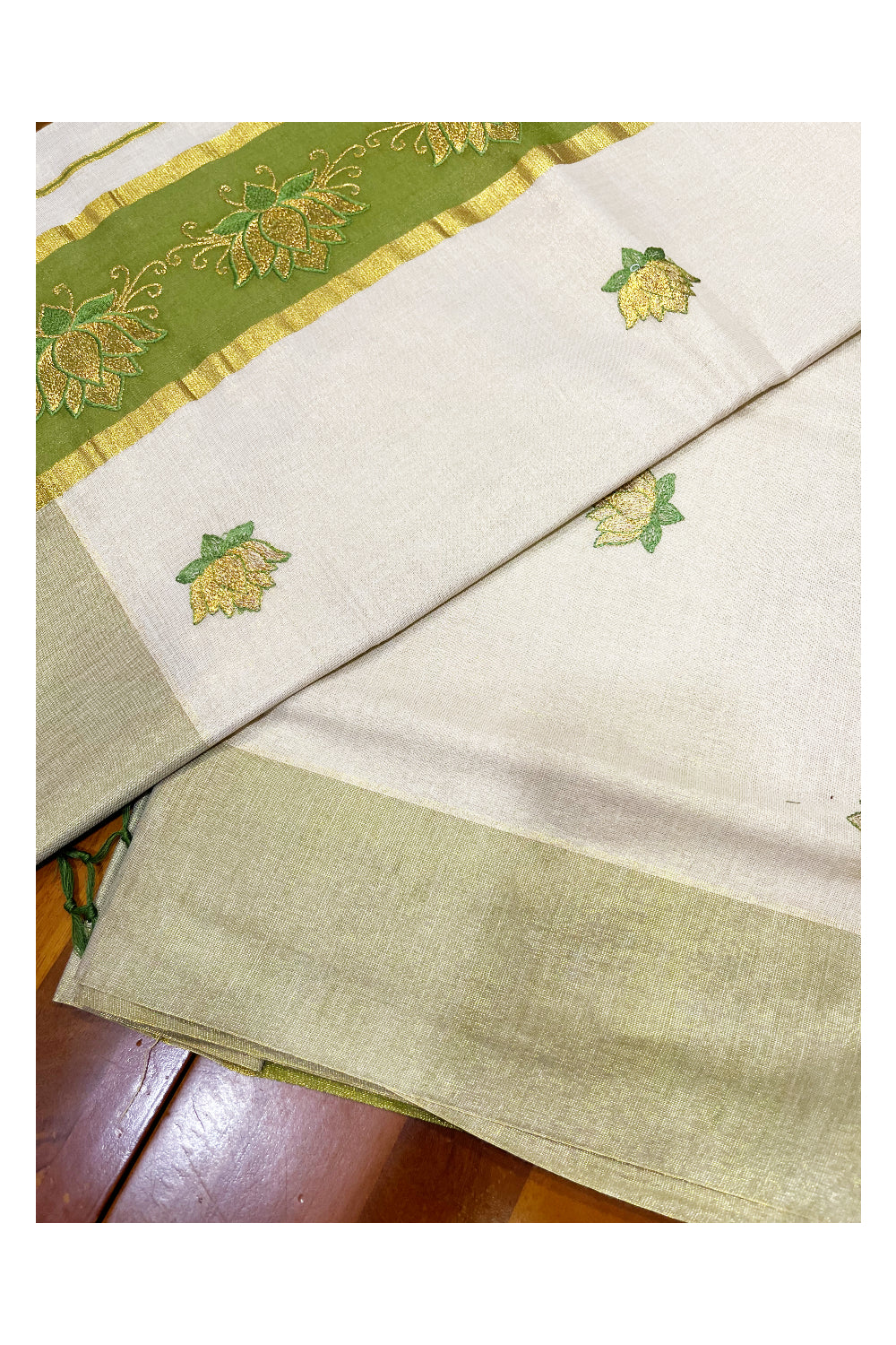 Southloom Kerala Tissue Kasavu Saree with Olive Green And Golden Lotus Embroidary Designs on Body