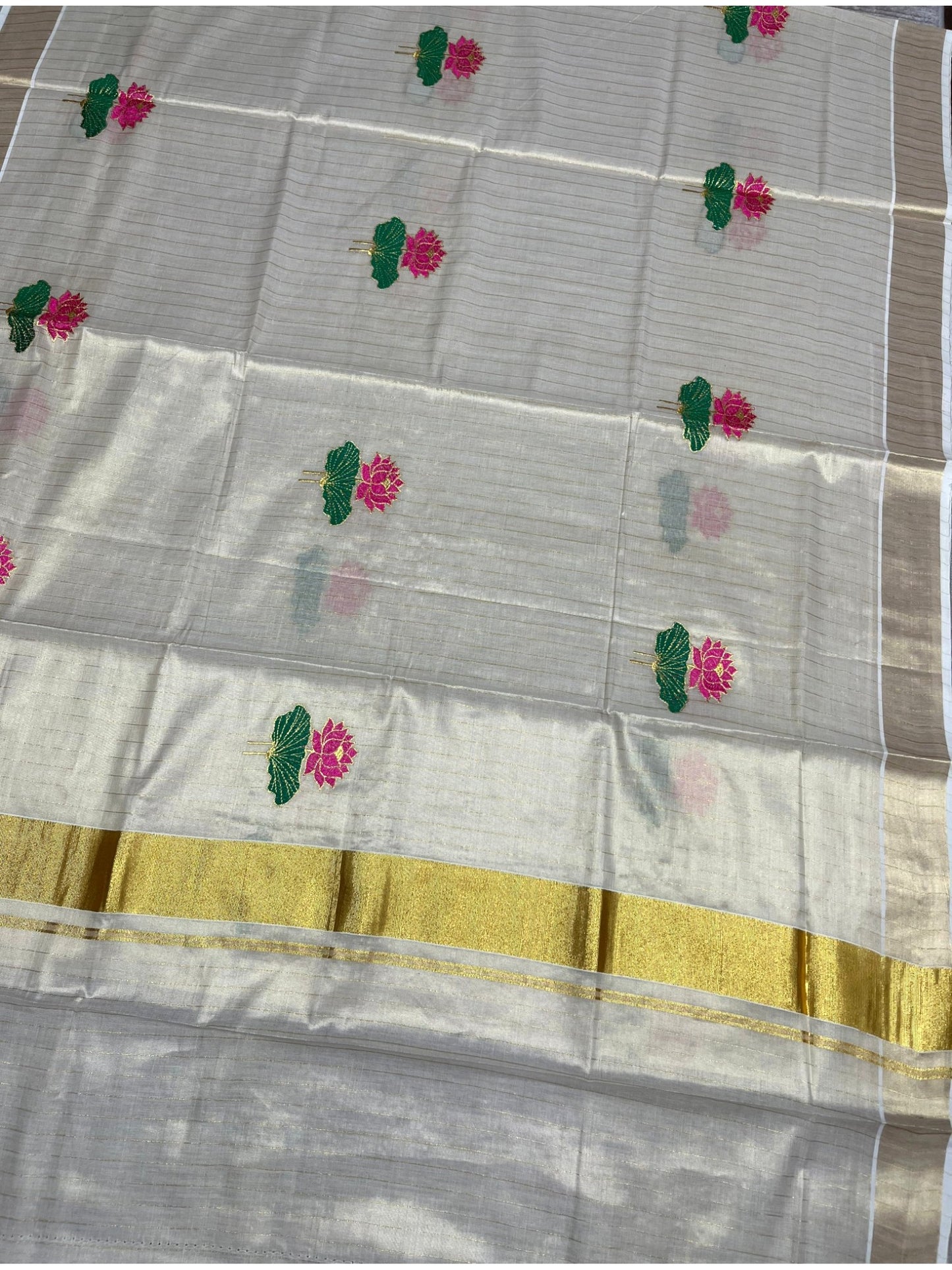 Southloom Kerala Tissue Kasavu Saree with Pink And Green Lotus Embroidary Works on Body