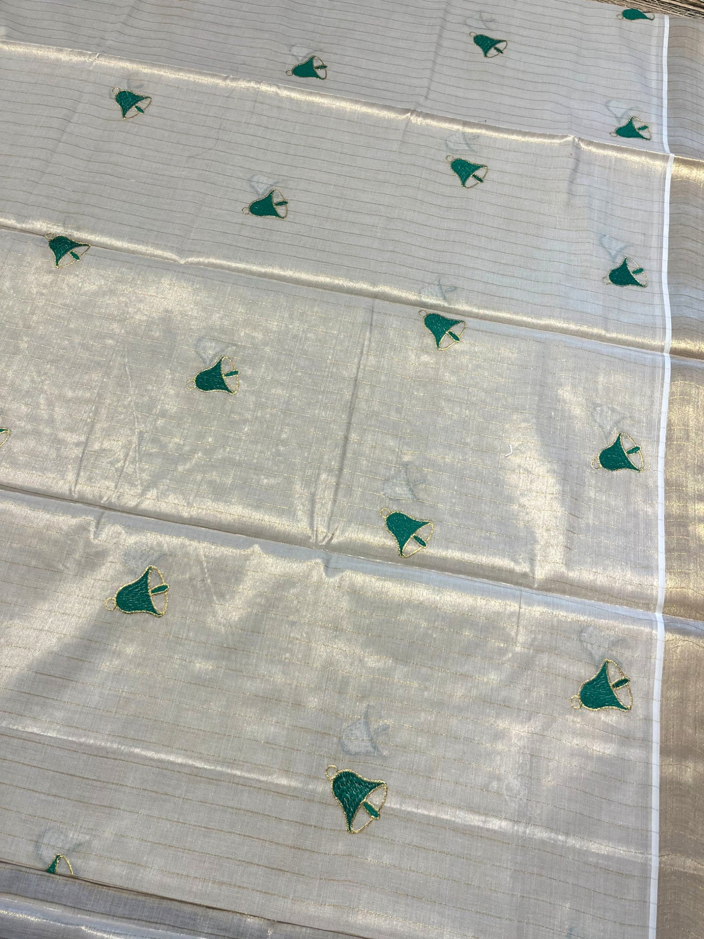 Southloom Tissue Kerala Kasavu Saree with Hand Painted Embroidery Nandi and Lotus Design