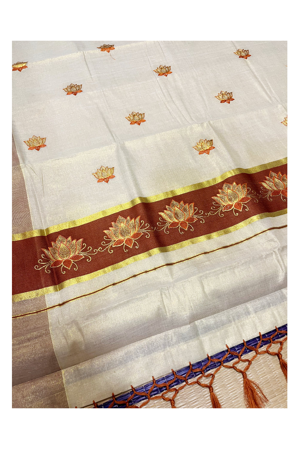 Southloom Kerala Tissue Kasavu Saree with Brown And Golden Lotus Embroidary Designs on Body