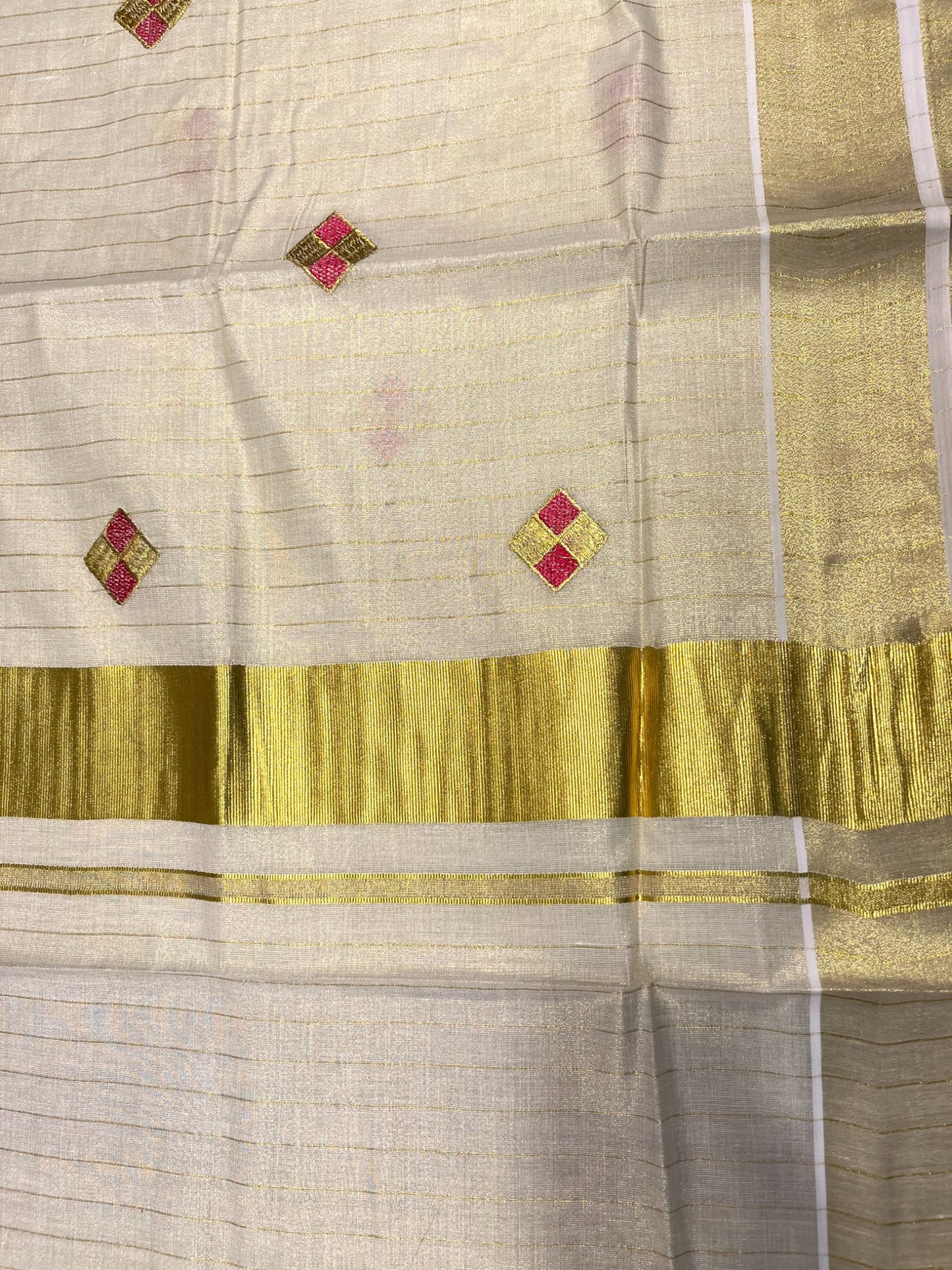 Kerala Tissue Kasavu Stripes Saree with Pink and Gold Embroidery Design on Body