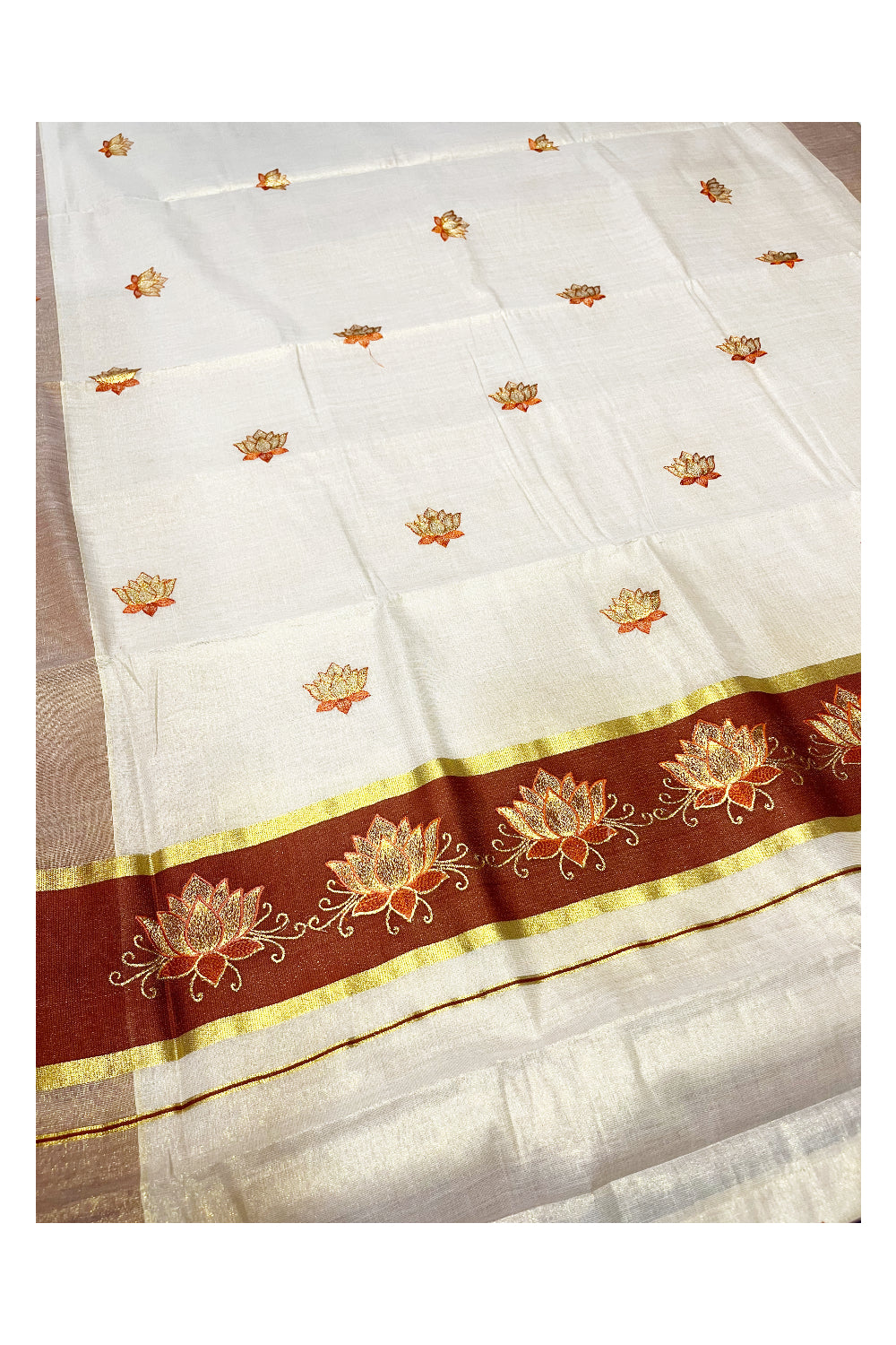 Southloom Kerala Tissue Kasavu Saree with Brown And Golden Lotus Embroidary Designs on Body