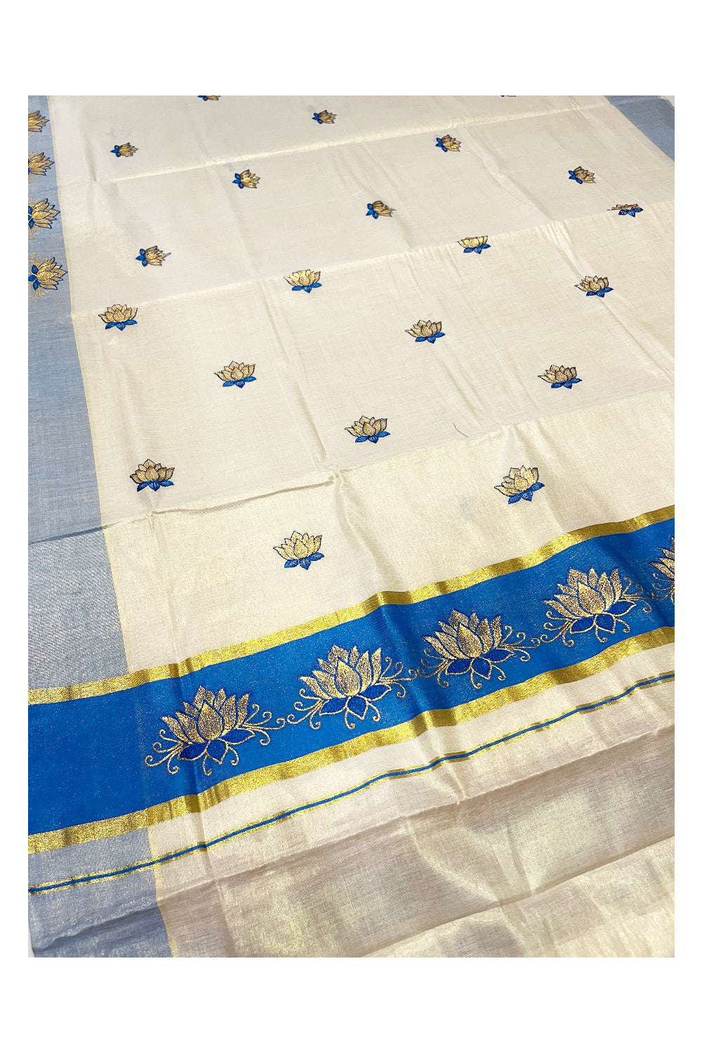 Southloom Kerala Tissue Kasavu Saree with Blue And Golden Lotus Embroidary Designs on Body