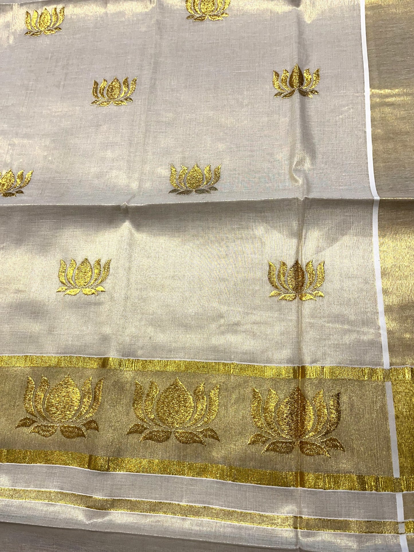 Southloom Tissue Kerala Kasavu Saree with Lotus Embroidery Design