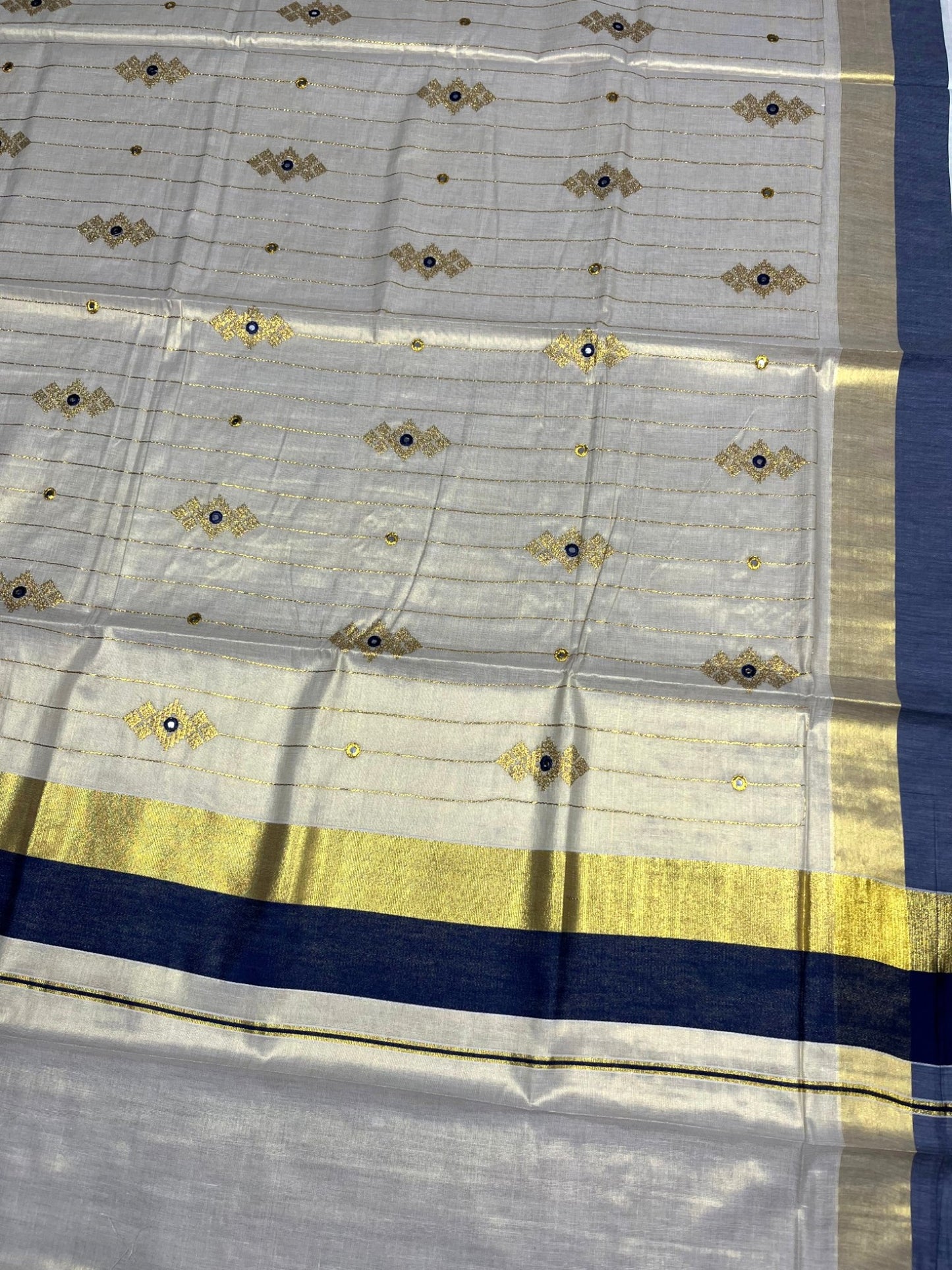 Southloom Kerala Tissue Kasavu Lines Saree with Golden And Blue Embroidery Works
