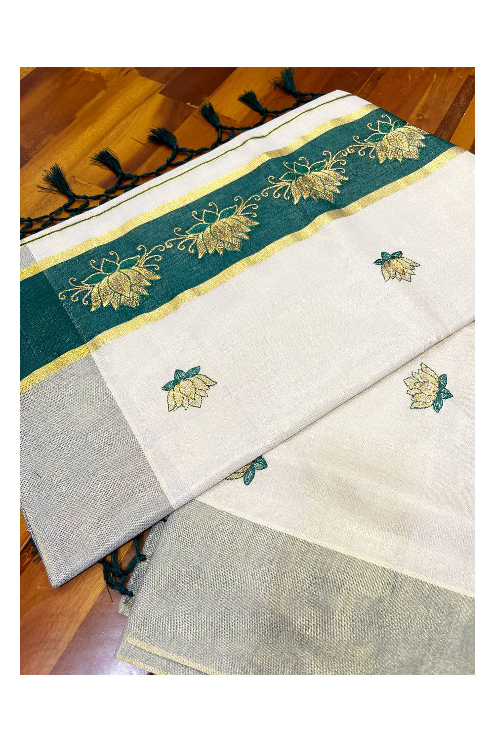 Southloom Kerala Tissue Kasavu Saree with Green And Golden Lotus Embroidary Designs on Body