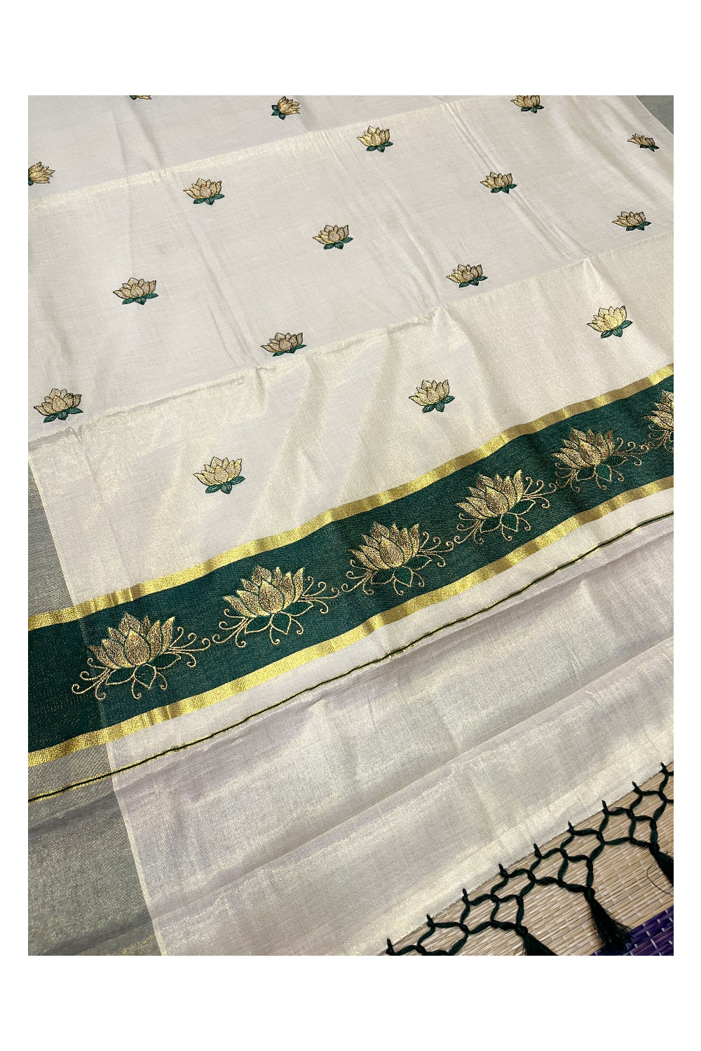 Southloom Kerala Tissue Kasavu Saree with Green And Golden Lotus Embroidary Designs on Body