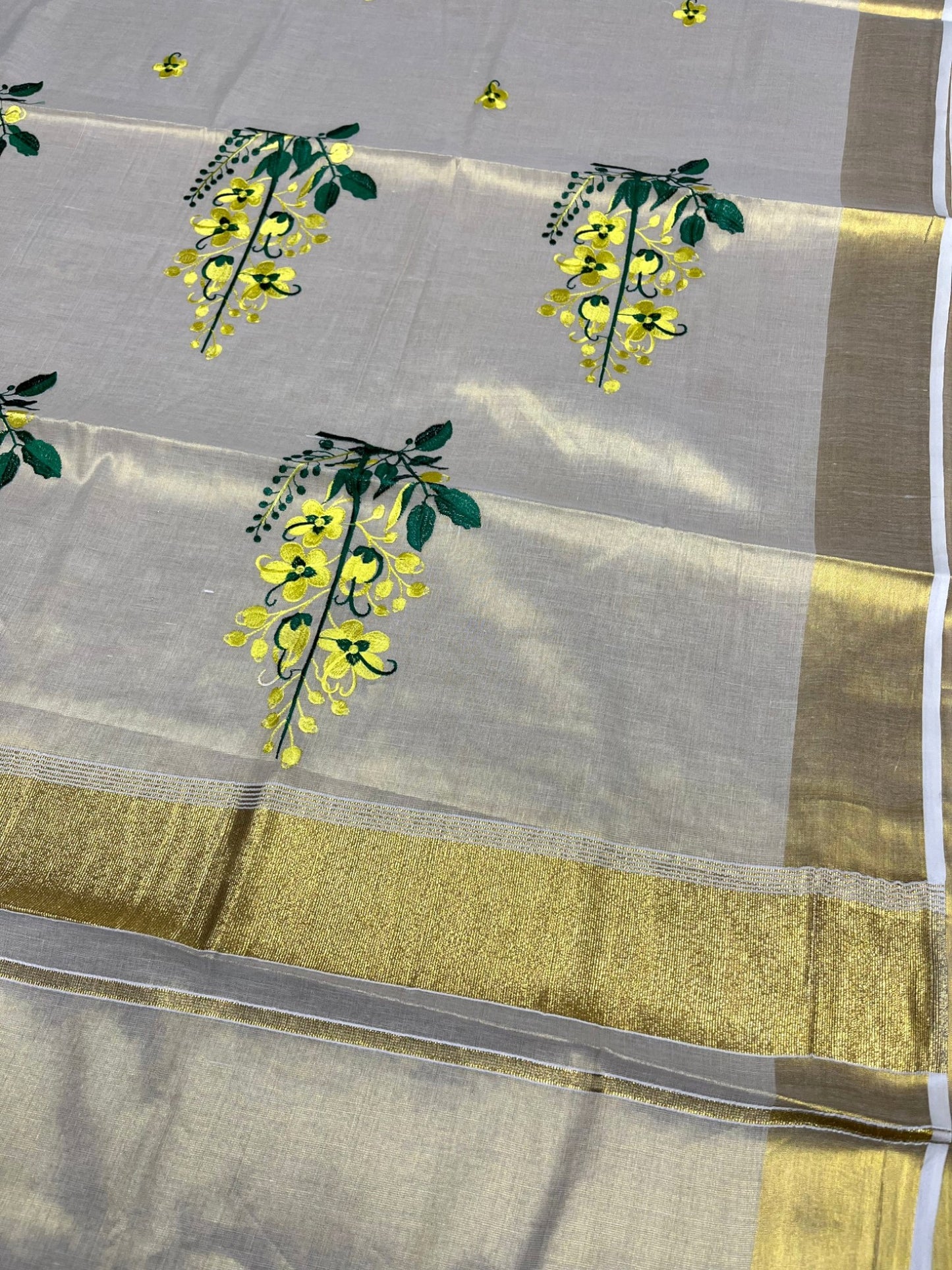Southloom Tissue Kerala Kasavu Saree with Kanikonna Embroidery Work on Body