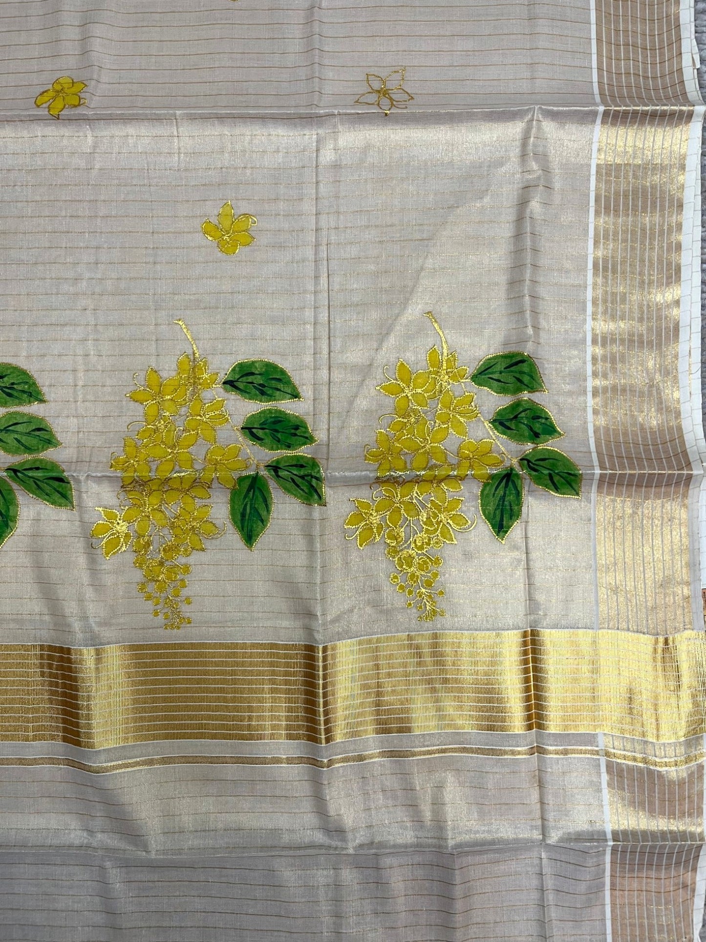 Southloom Tissue Kerala Kasavu Saree with Kanikonna Embroidery Work on Body