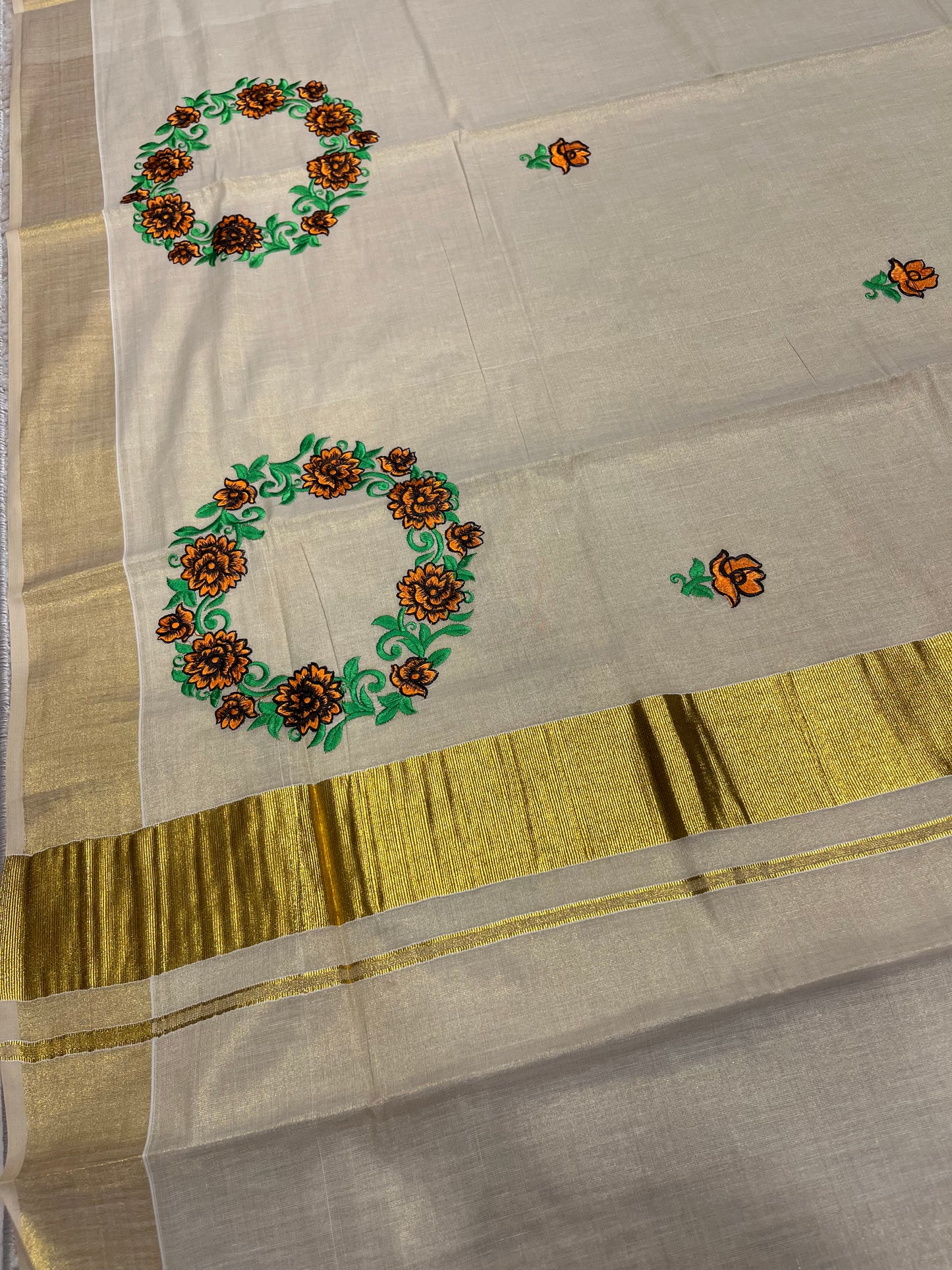 Southloom Tissue Kerala Kasavu Saree with Floral Embroidery Design