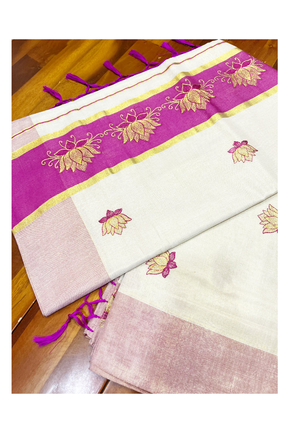 Southloom Kerala Tissue Kasavu Saree with Magenta And Golden Lotus Embroidary Designs on Body