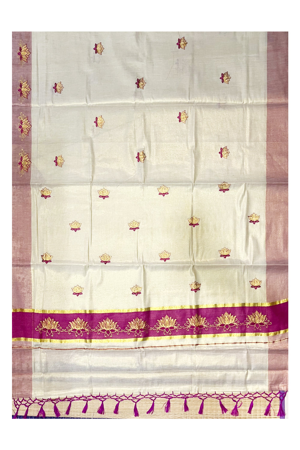 Southloom Kerala Tissue Kasavu Saree with Magenta And Golden Lotus Embroidary Designs on Body