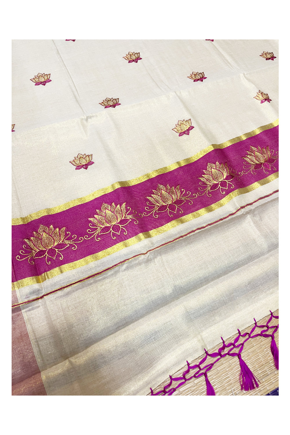 Southloom Kerala Tissue Kasavu Saree with Magenta And Golden Lotus Embroidary Designs on Body