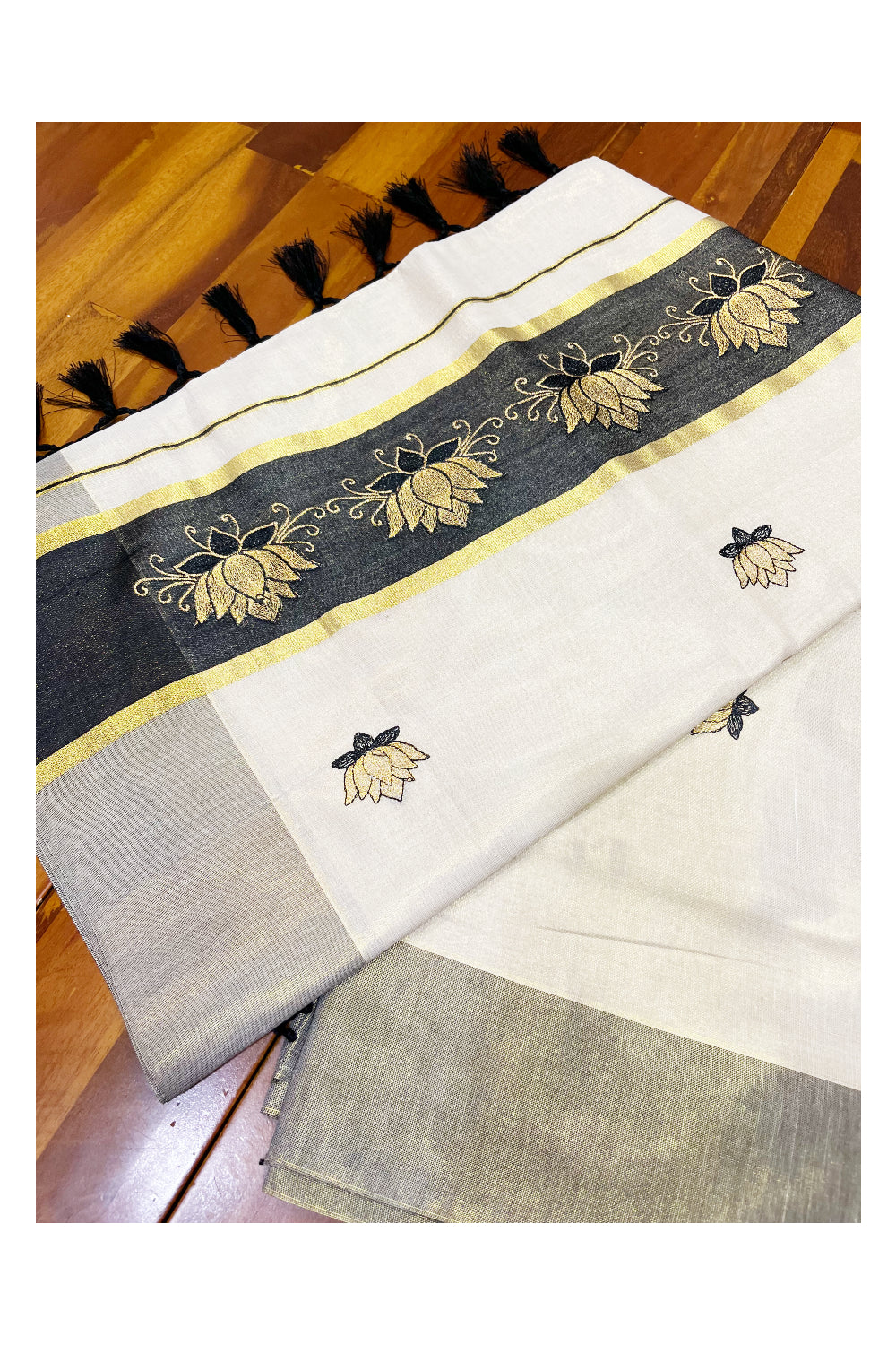 Southloom Kerala Tissue Kasavu Saree with Black And Golden Lotus Embroidary Designs on Body