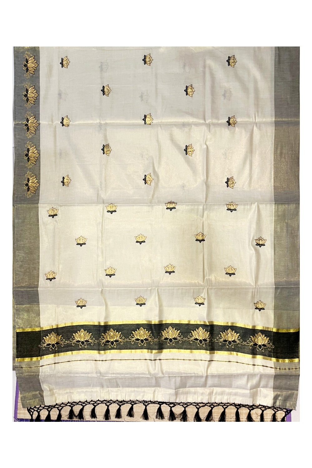 Southloom Kerala Tissue Kasavu Saree with Black And Golden Lotus Embroidary Designs on Body