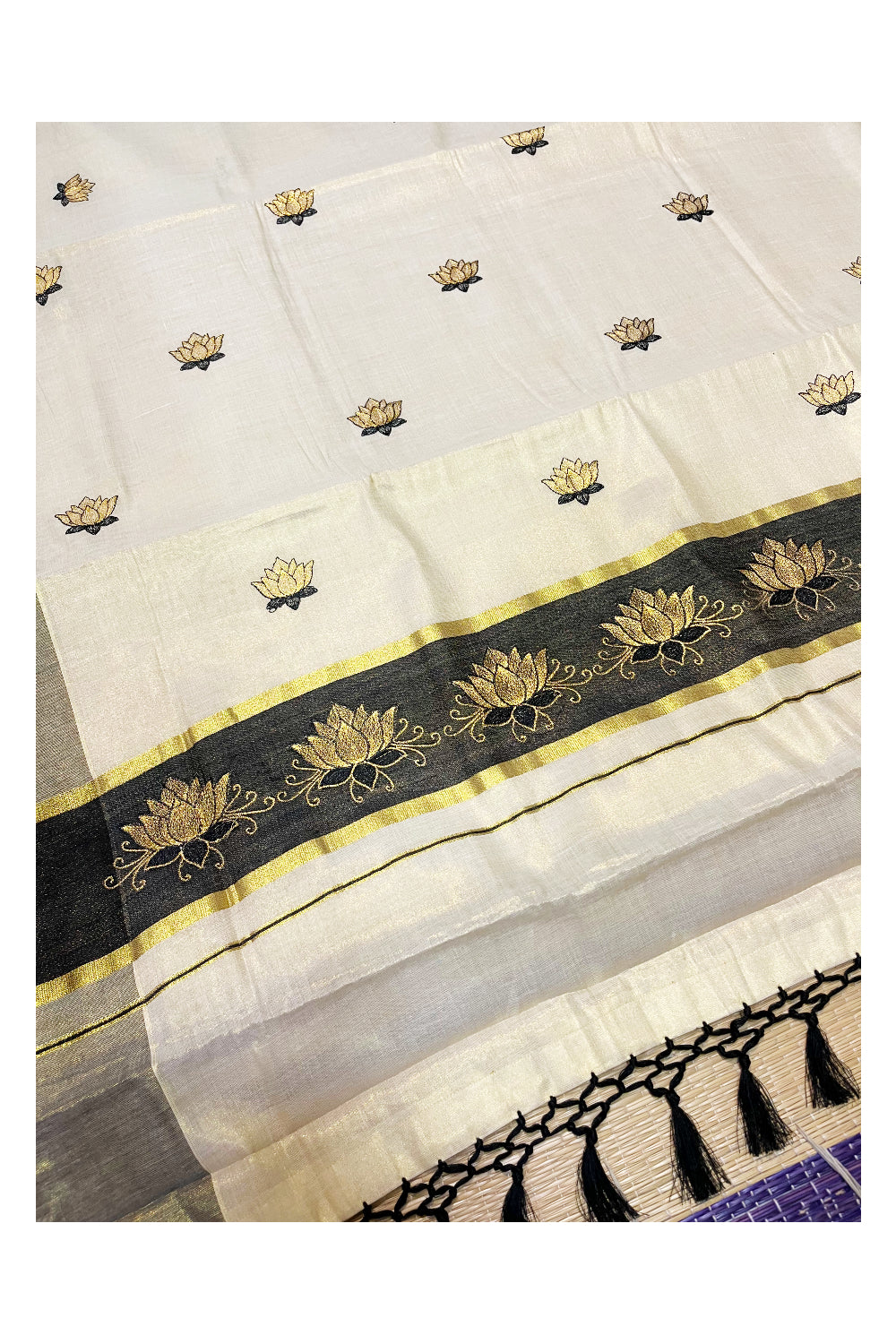 Southloom Kerala Tissue Kasavu Saree with Black And Golden Lotus Embroidary Designs on Body