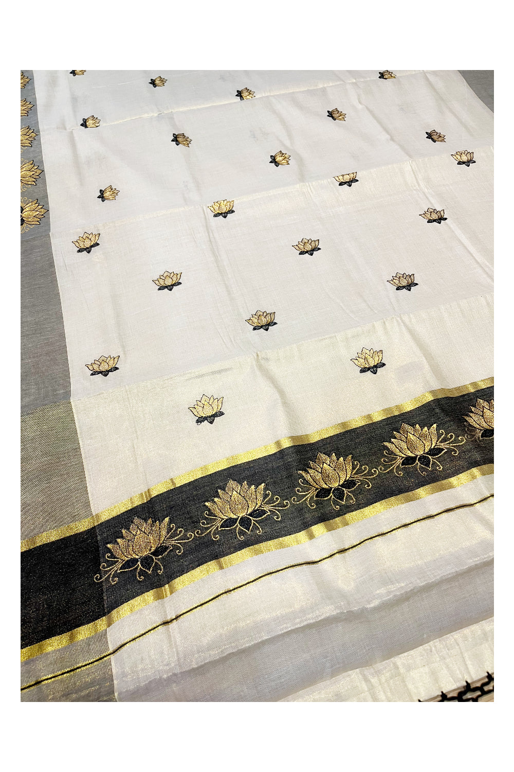 Southloom Kerala Tissue Kasavu Saree with Black And Golden Lotus Embroidary Designs on Body