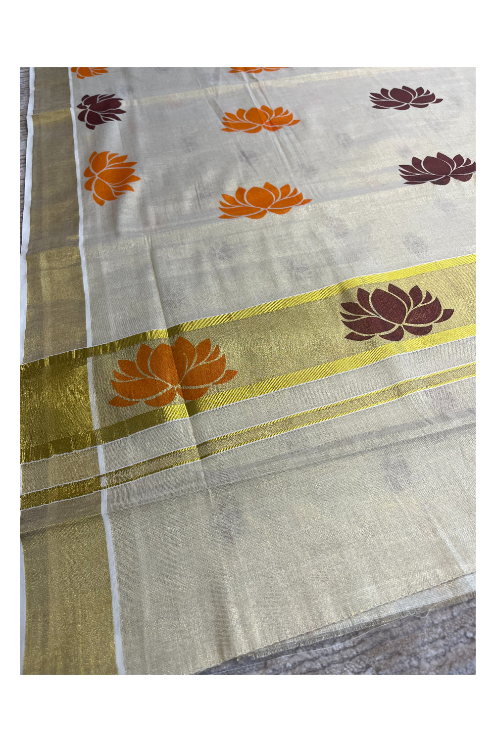 Southloom Kerala Tissue Saree with Orange And Brown Lotus Block Prints On Kasavu Border