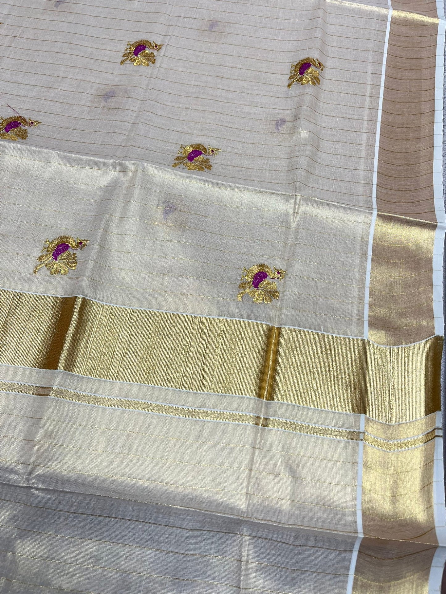 Southloom Tissue Kerala Kasavu Lines Saree with Peacock Embroidery Work on Body in Magenta
