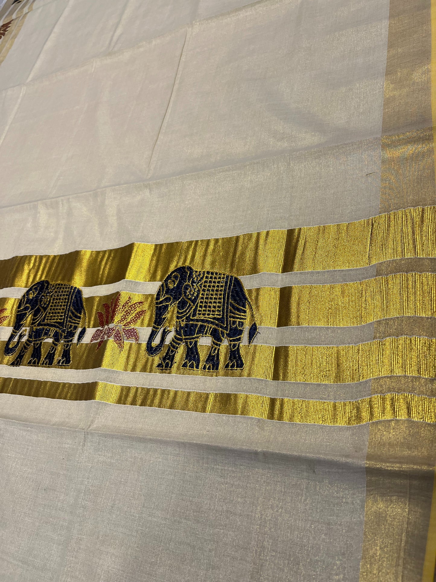 Southloom Tissue Kerala Kasavu Lines Saree with Elephant Embroidery Designs on Body