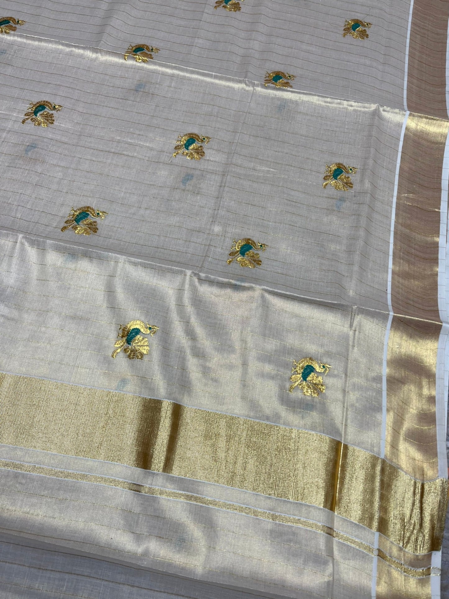 Southloom Tissue Kerala Kasavu Lines Saree with Peacock Embroidery Work on Body in Peacock Green