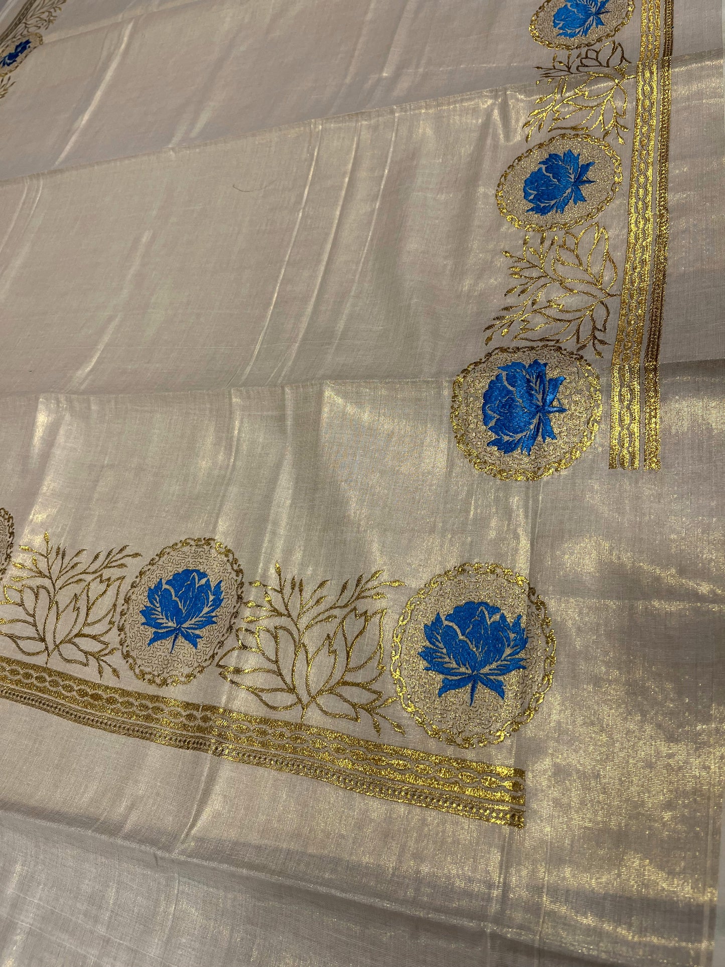 Southloom Tissue Kerala Kasavu Saree with Blue Floral Print on Border