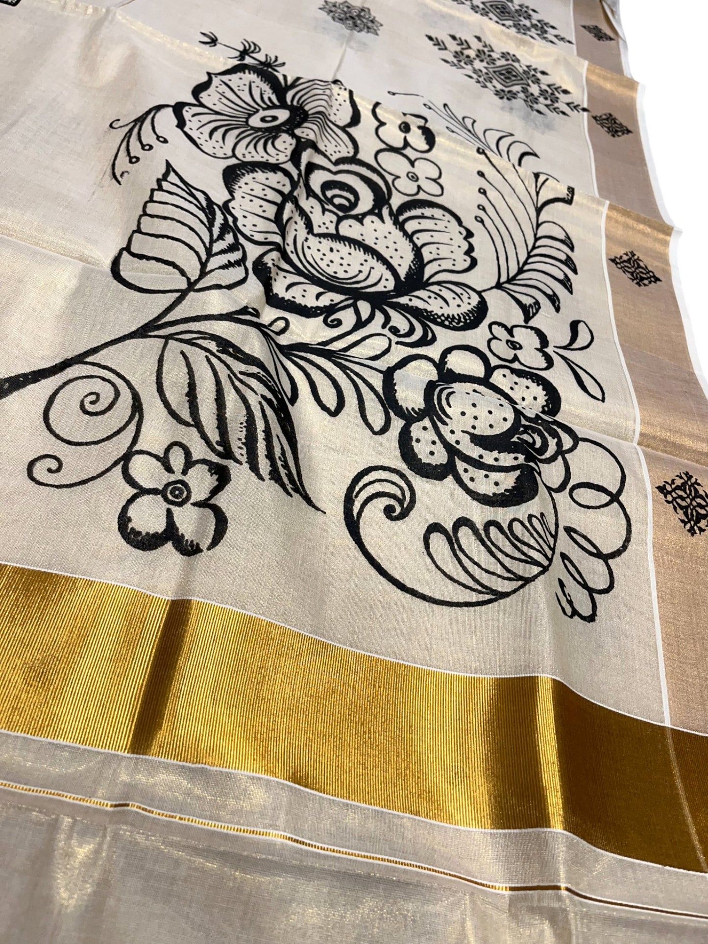 Kerala Tissue Kasavu Saree with Black Floral Block Printed Designs