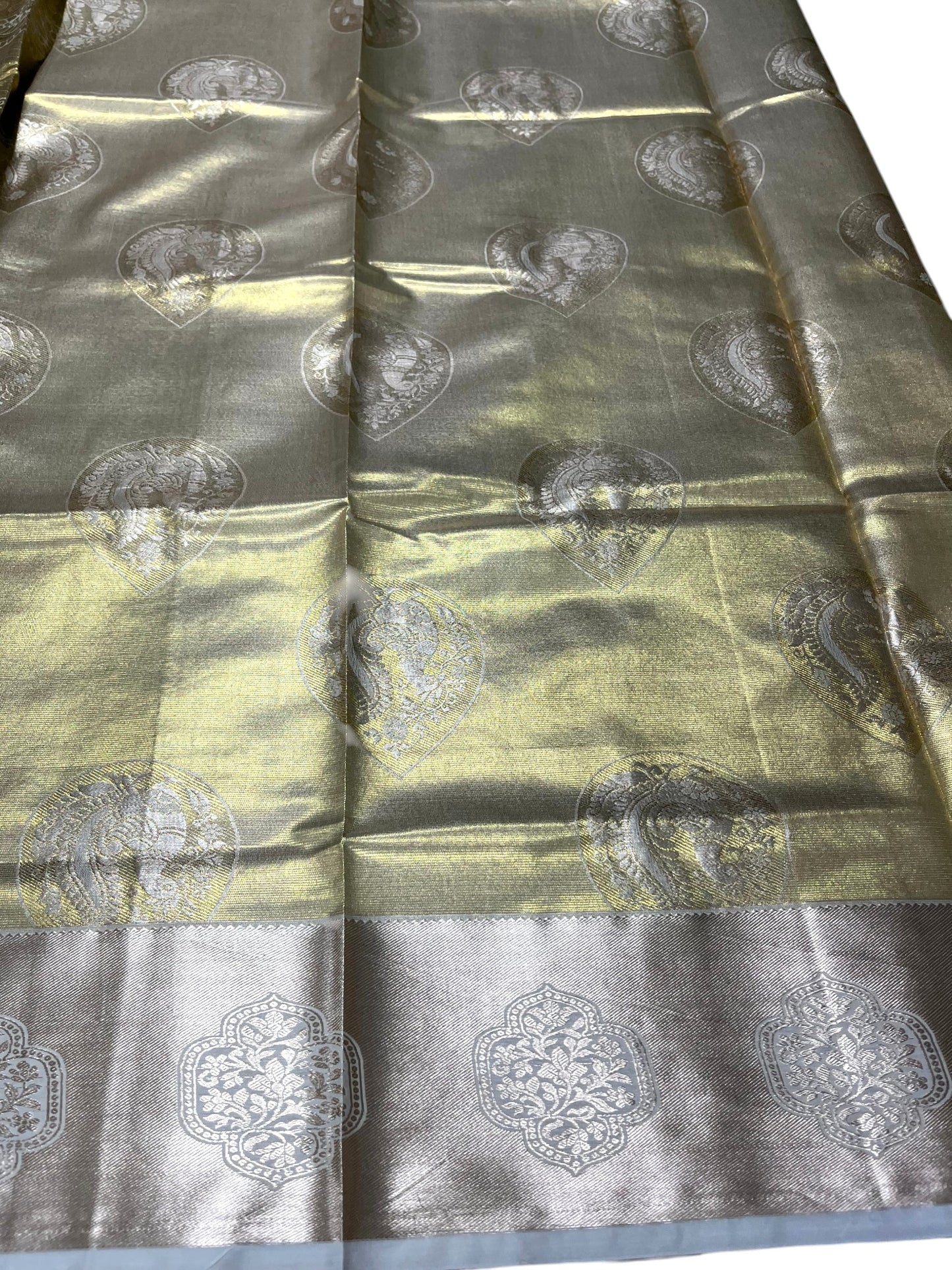 Southloom Kerala Tissue Kasavu Heavy Work Saree with Paisley Floral Woven Design