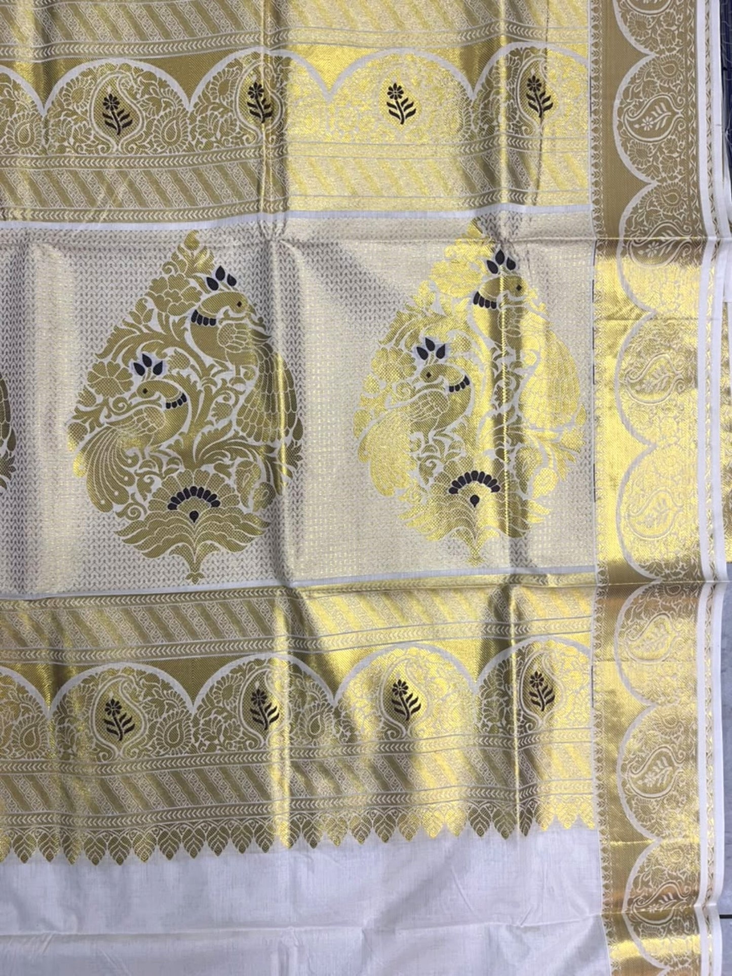 Southloom Tissue Kerala Kasavu Heavy Work Saree with Peacock Woven Design on Borders