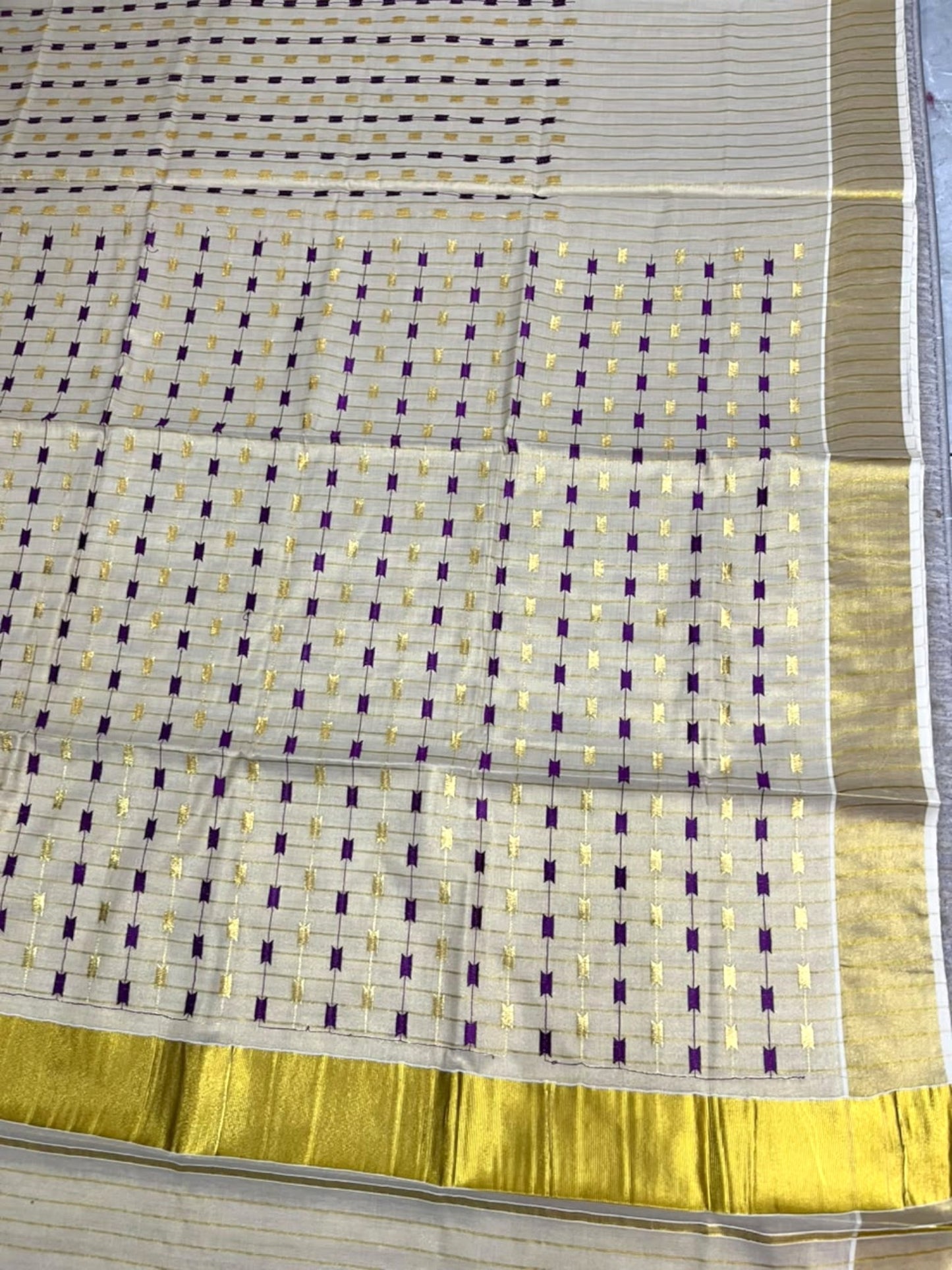 Southloom Tissue Kerala Kasavu Saree with Purple & Gold Embroidery Designs on Body