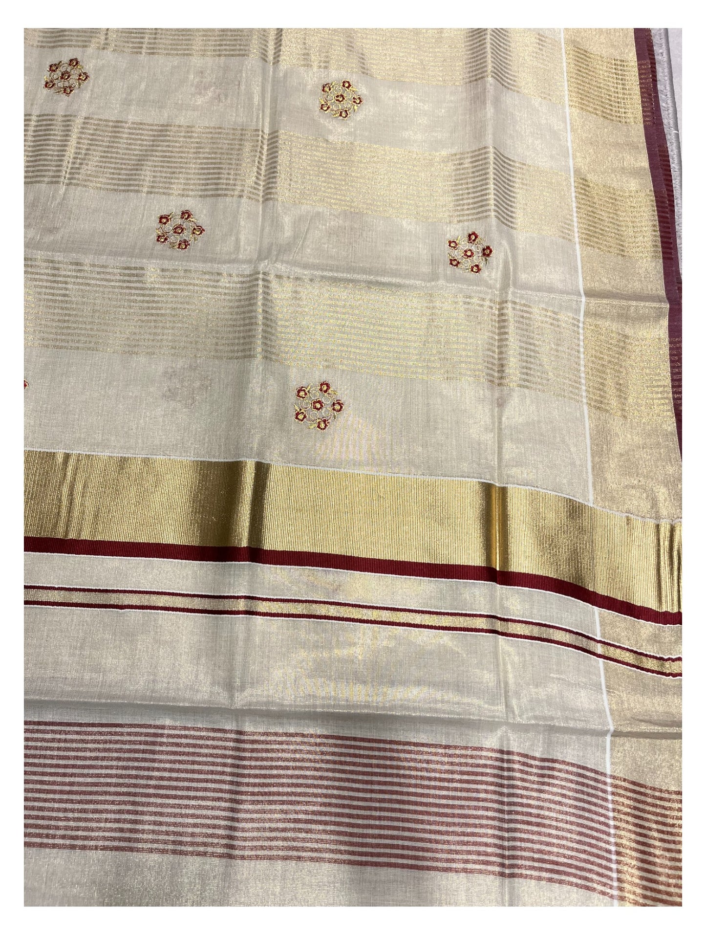 Kerala Tissue Kasavu Lines Saree with Golden And Maroon Embroidery Works