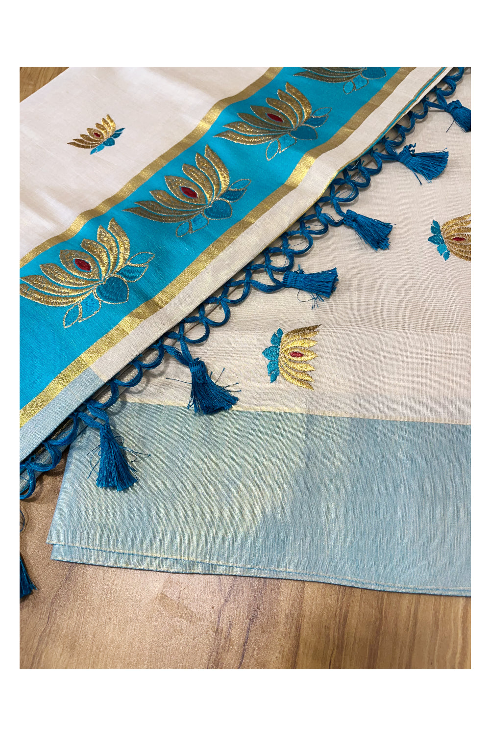 Southloom Kerala Tissue Kasavu Saree with Turquoise And Golden Lotus Embroidary Works on Body