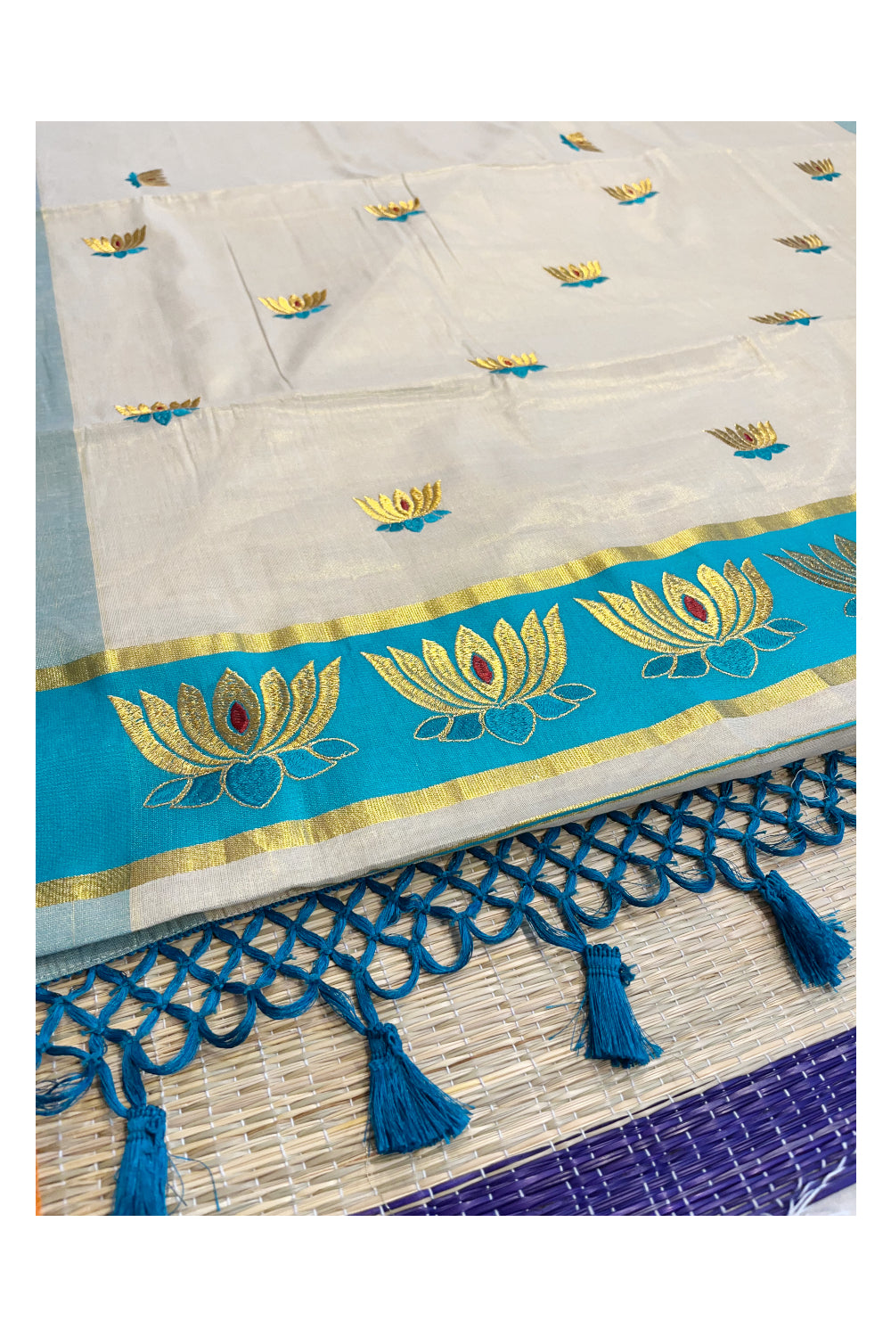 Southloom Kerala Tissue Kasavu Saree with Turquoise And Golden Lotus Embroidary Works on Body