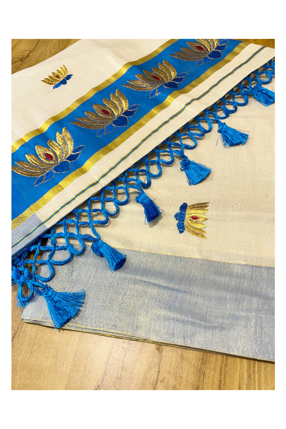 Southloom Kerala Tissue Kasavu Saree with Blue And Golden Lotus Embroidary Works on Body