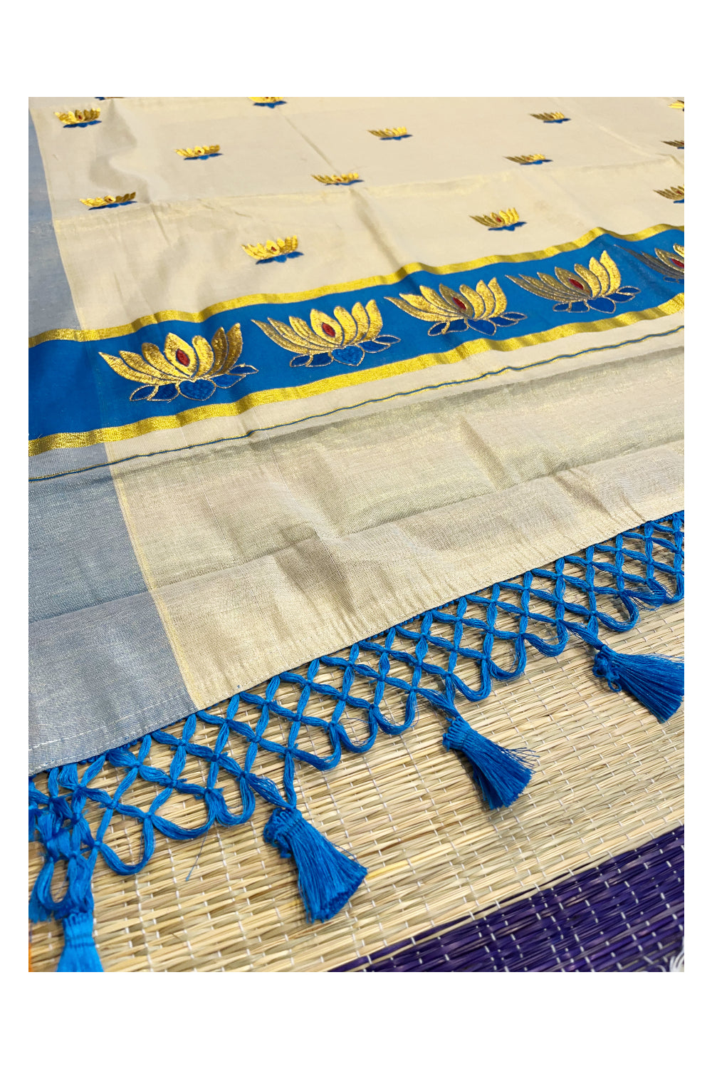 Southloom Kerala Tissue Kasavu Saree with Blue And Golden Lotus Embroidary Works on Body