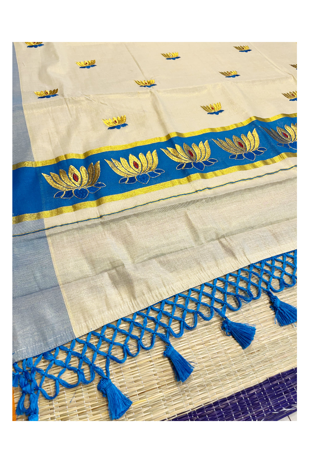 Southloom Kerala Tissue Kasavu Saree with Blue And Golden Lotus Embroidary Works on Body