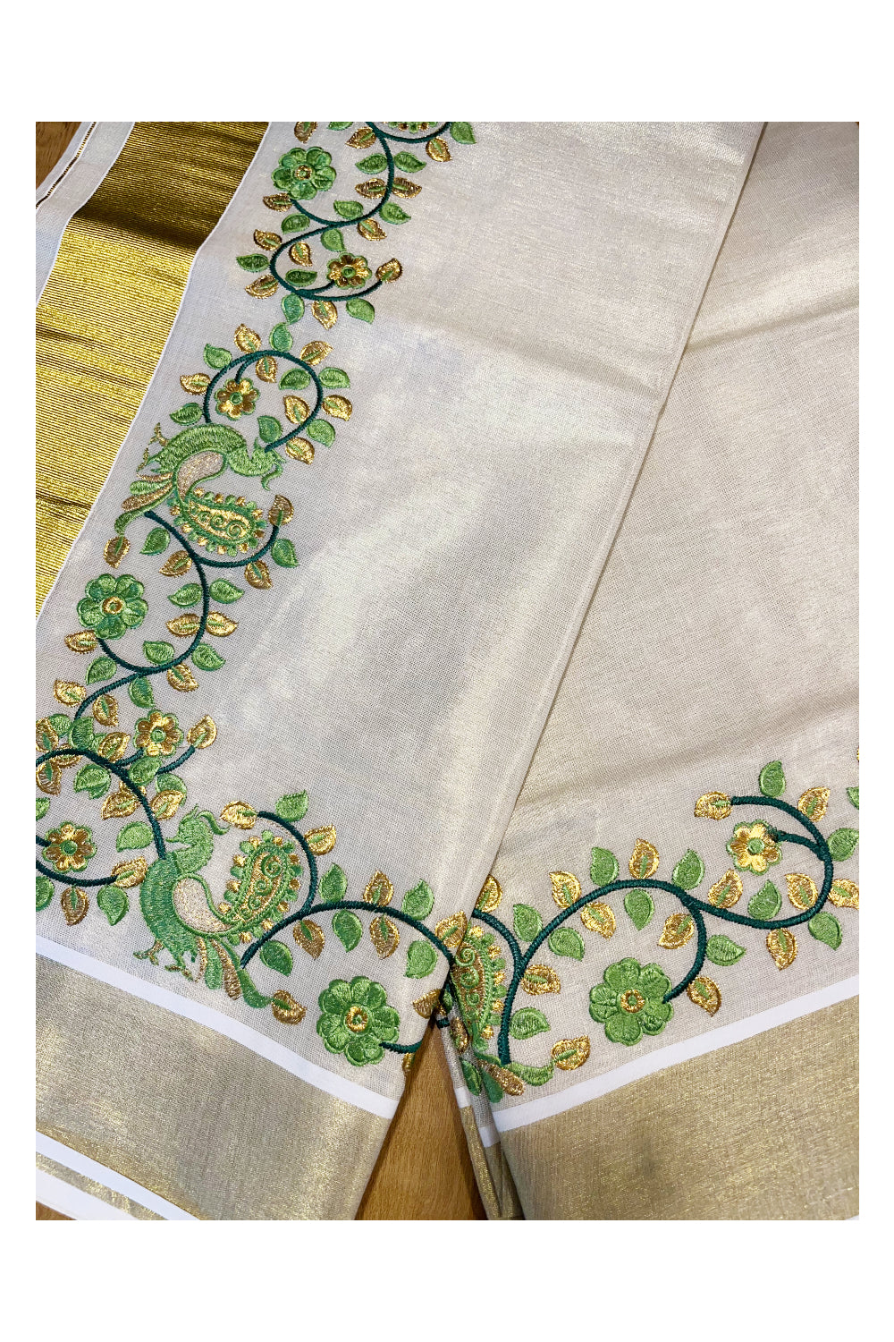 Kerala Tissue Kasavu Saree with Green Peacock Embroidery Design