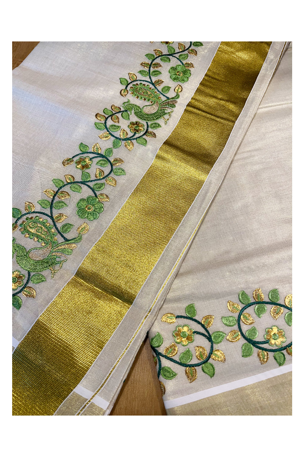 Kerala Tissue Kasavu Saree with Green Peacock Embroidery Design
