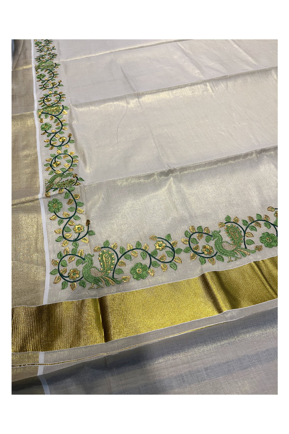 Kerala Tissue Kasavu Saree with Green Peacock Embroidery Design
