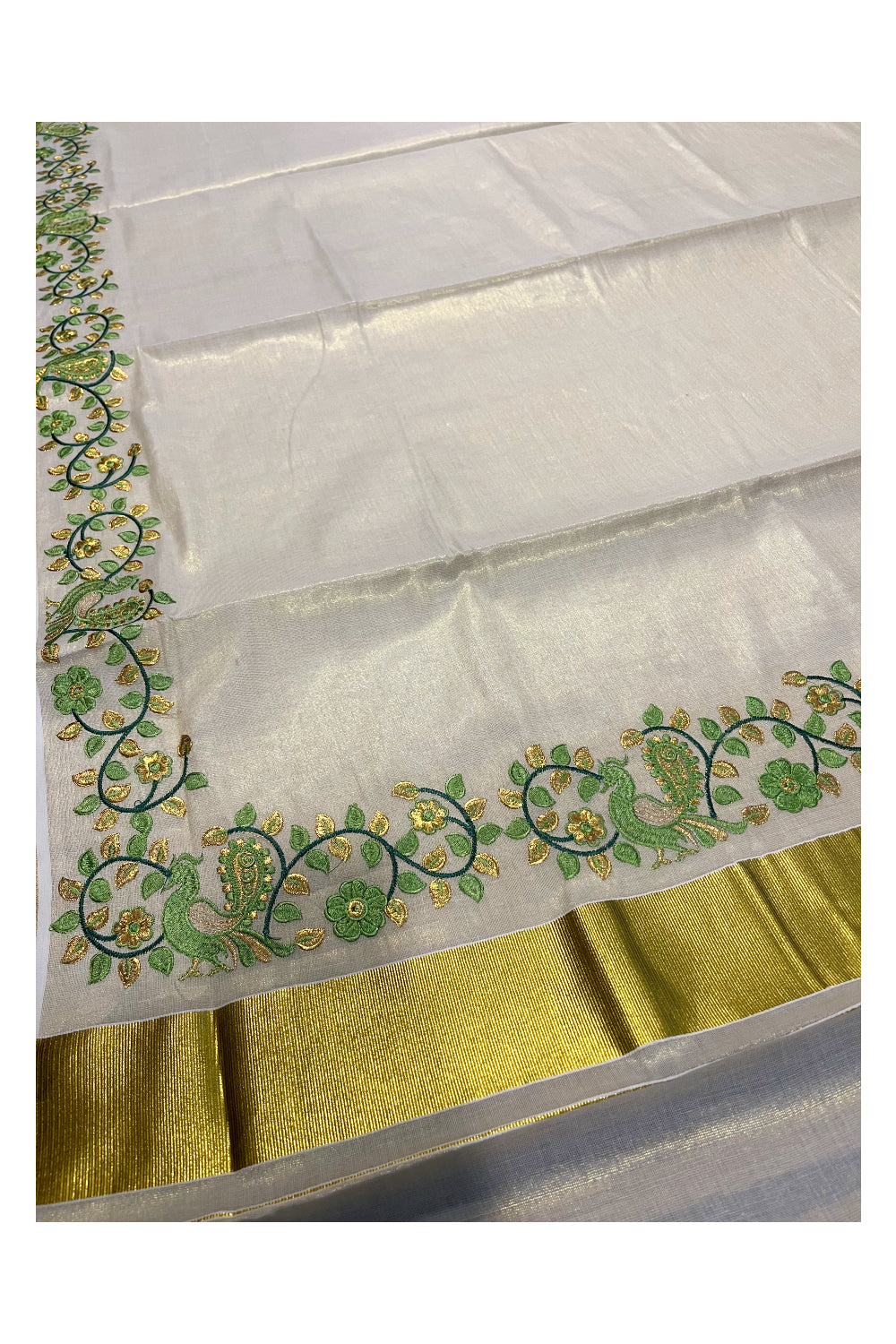 Kerala Tissue Kasavu Saree with Green Peacock Embroidery Design