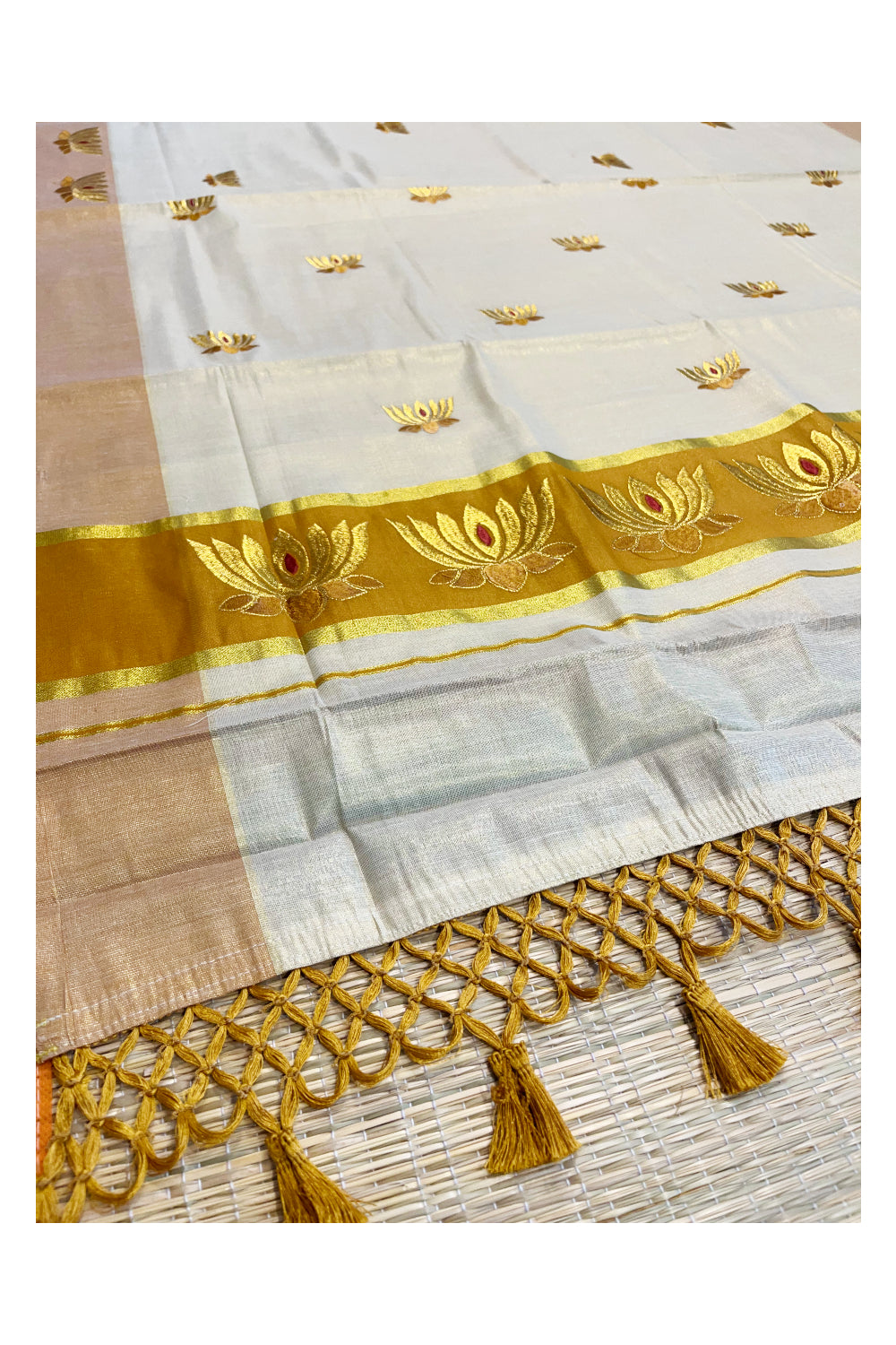 Southloom Kerala Tissue Kasavu Saree with Saffron And Golden Lotus Embroidary Works on Body SL273