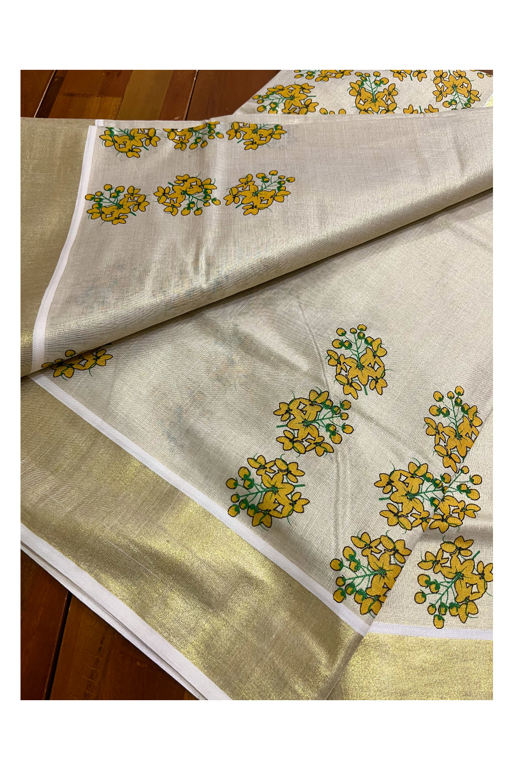 Kerala Tissue Kasavu Saree with Floral Prints on Body and Kasavu Border